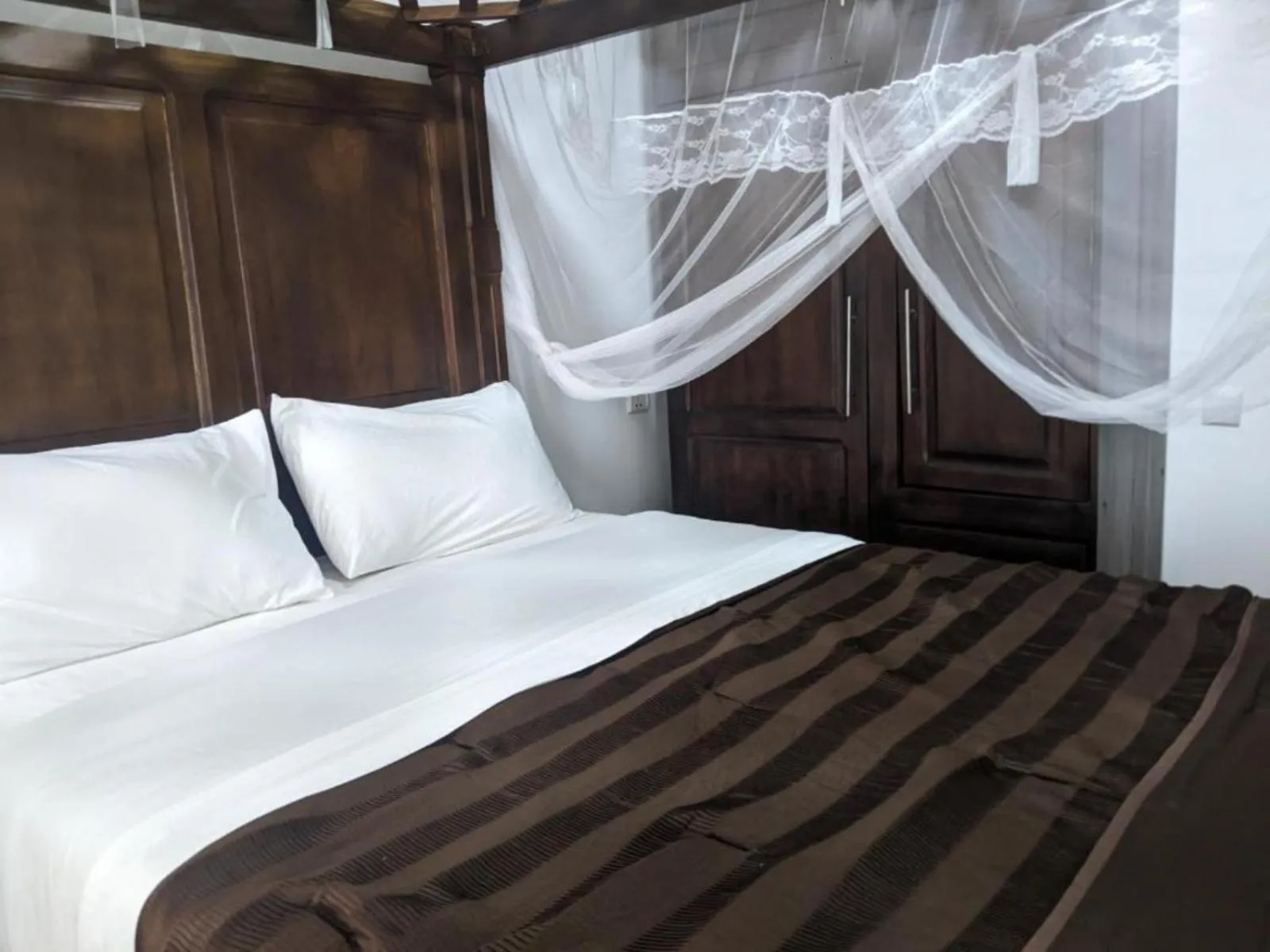 Bed in The Keza Hotel and Apartments