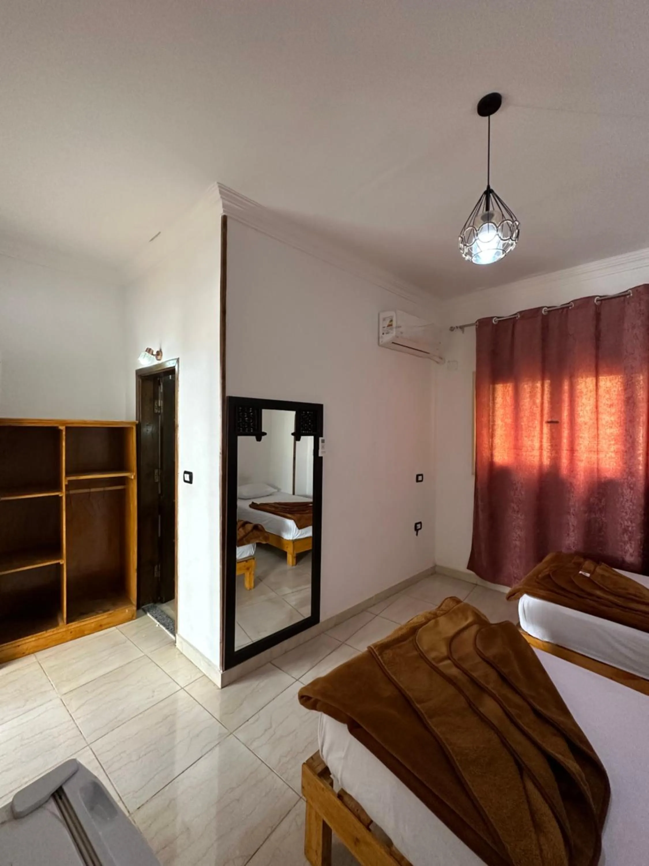 Bed in Seven Heaven Hotel And Diving Center