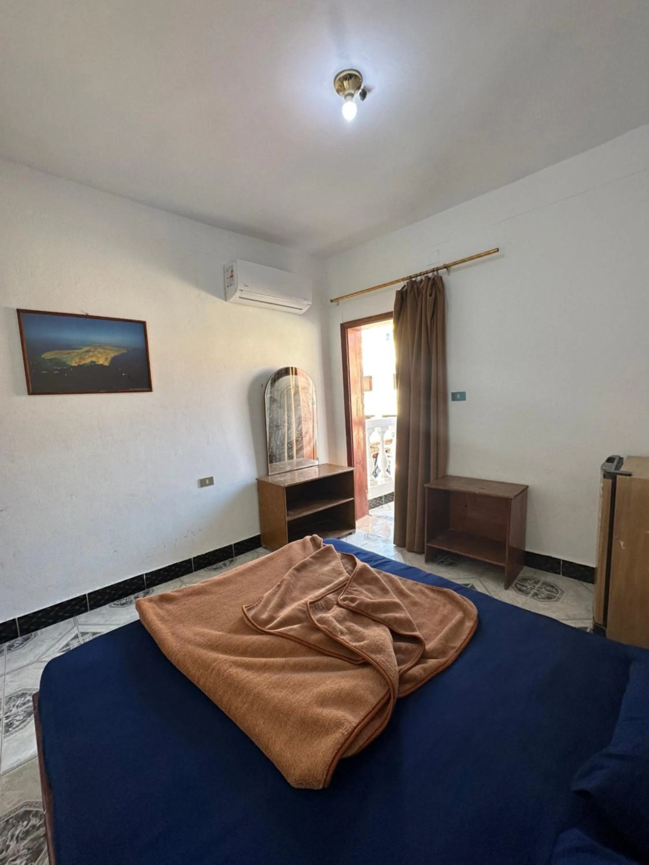 Bed in Seven Heaven Hotel And Diving Center