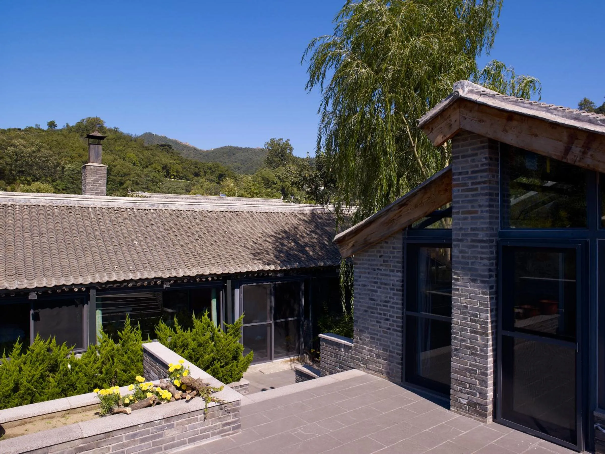 Mountain view in Brickyard Retreat at Mutianyu Great Wall Adjoin to Mutianyu Great Wall - Room with the View of Great Wall - Jacuzzi with the View of Great Wall - Vehicle Shuttle Service - International Catering - SPA& Nail Beauty Facilities