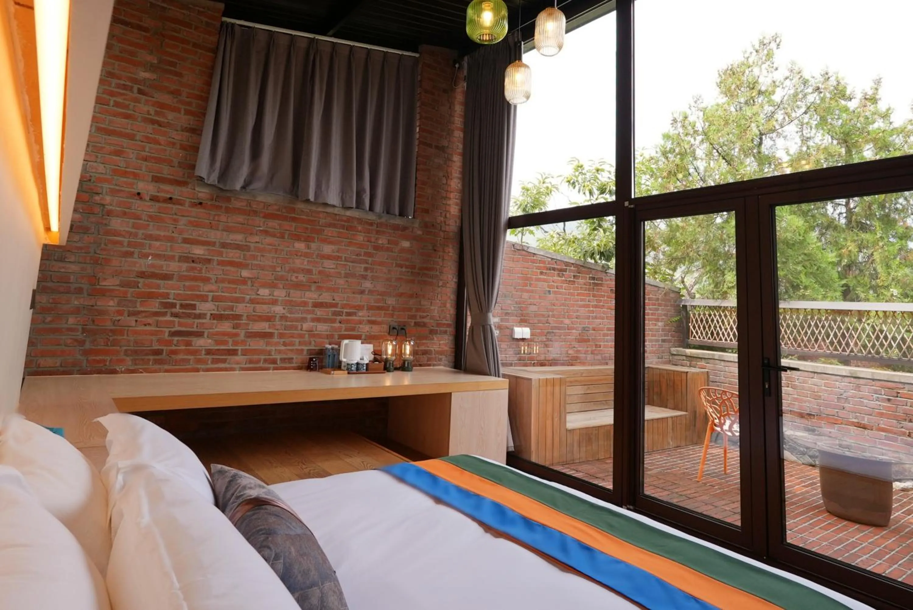 Bed in Brickyard Retreat at Mutianyu Great Wall Adjoin to Mutianyu Great Wall - Room with the View of Great Wall - Jacuzzi with the View of Great Wall - Vehicle Shuttle Service - International Catering - SPA& Nail Beauty Facilities