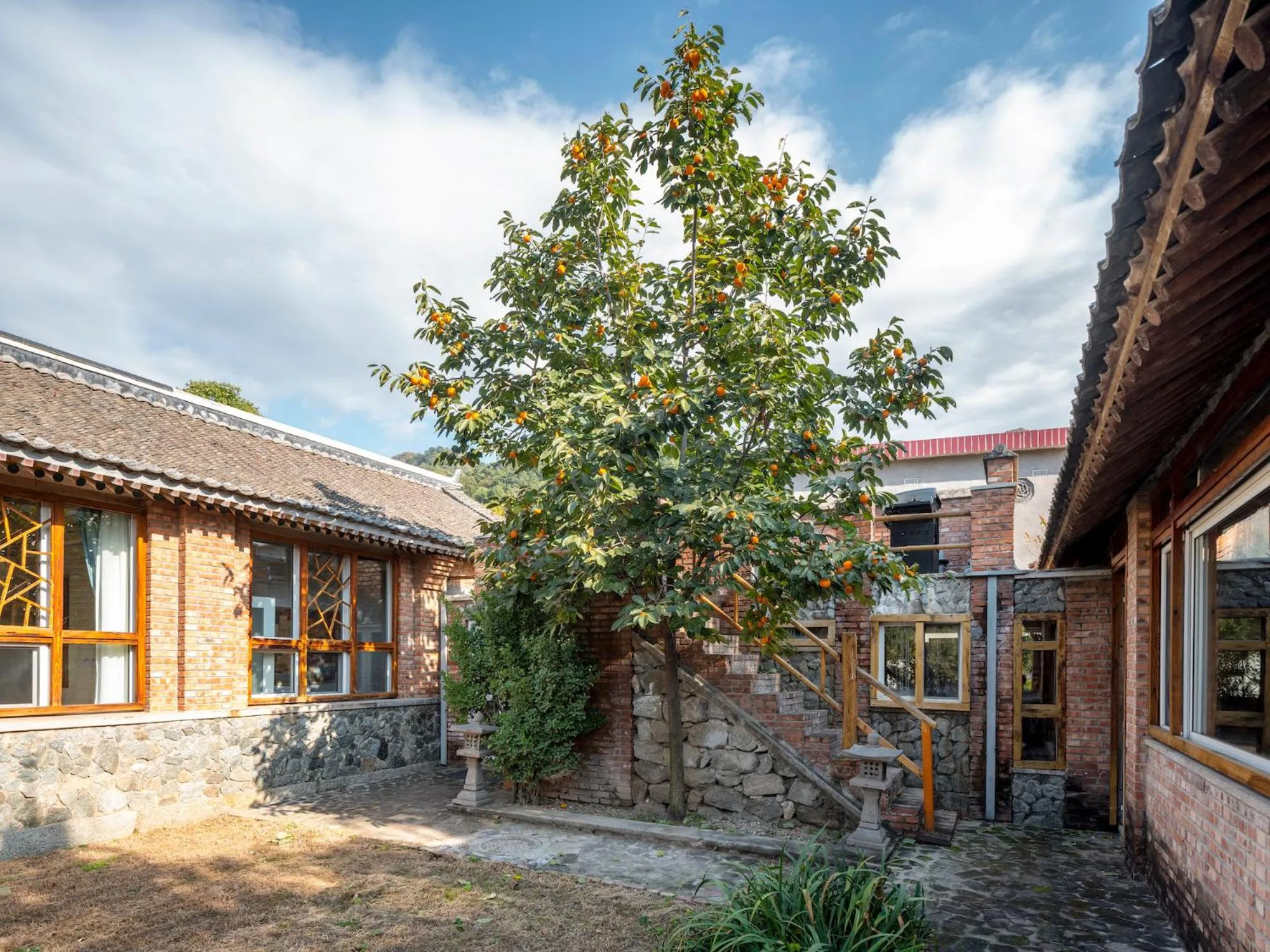 Property building in Brickyard Retreat at Mutianyu Great Wall Adjoin to Mutianyu Great Wall - Room with the View of Great Wall - Jacuzzi with the View of Great Wall - Vehicle Shuttle Service - International Catering - SPA& Nail Beauty Facilities