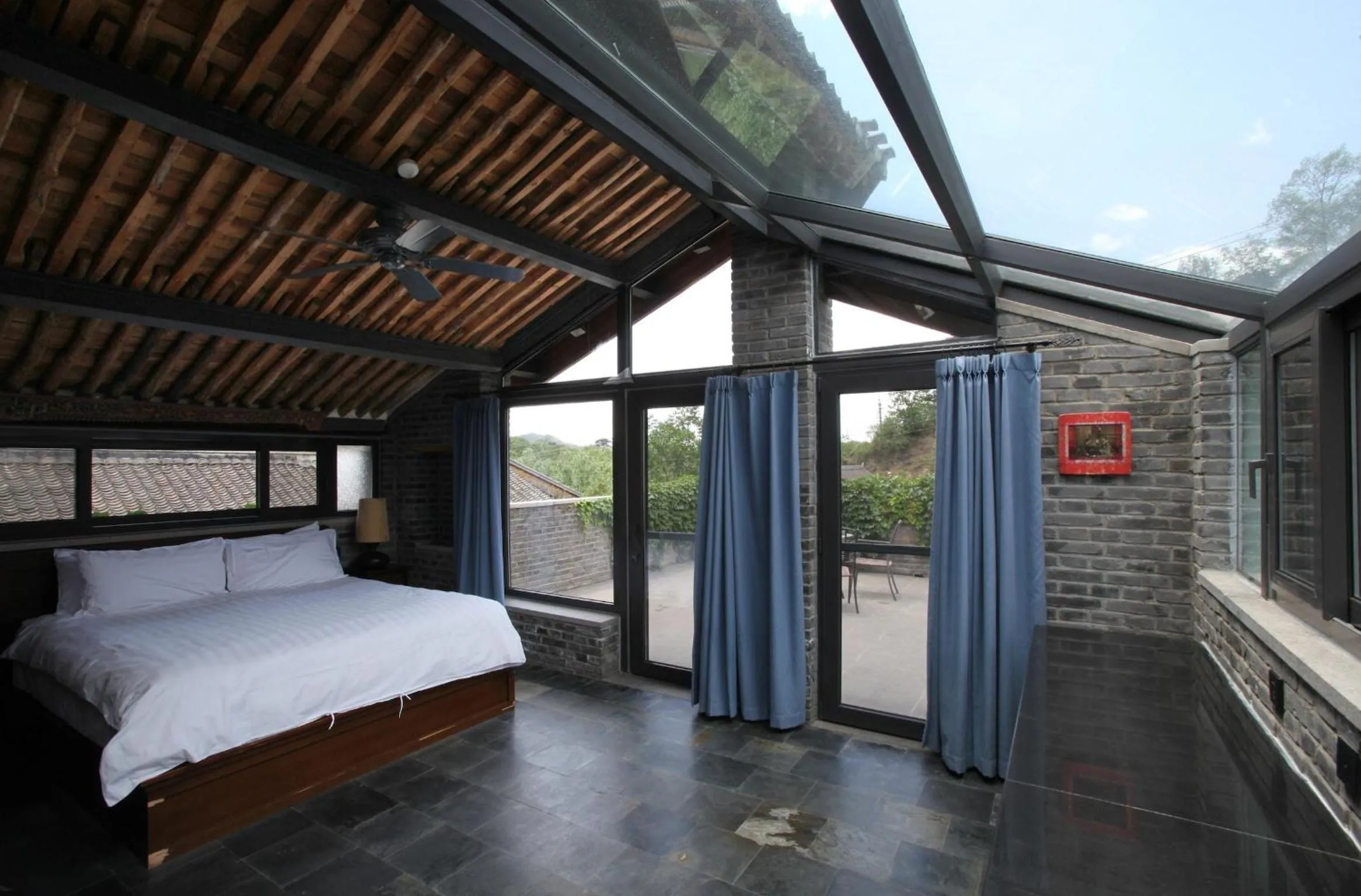 Photo of the whole room, Bed in Brickyard Retreat at Mutianyu Great Wall Adjoin to Mutianyu Great Wall - Room with the View of Great Wall - Jacuzzi with the View of Great Wall - Vehicle Shuttle Service - International Catering - SPA& Nail Beauty Facilities