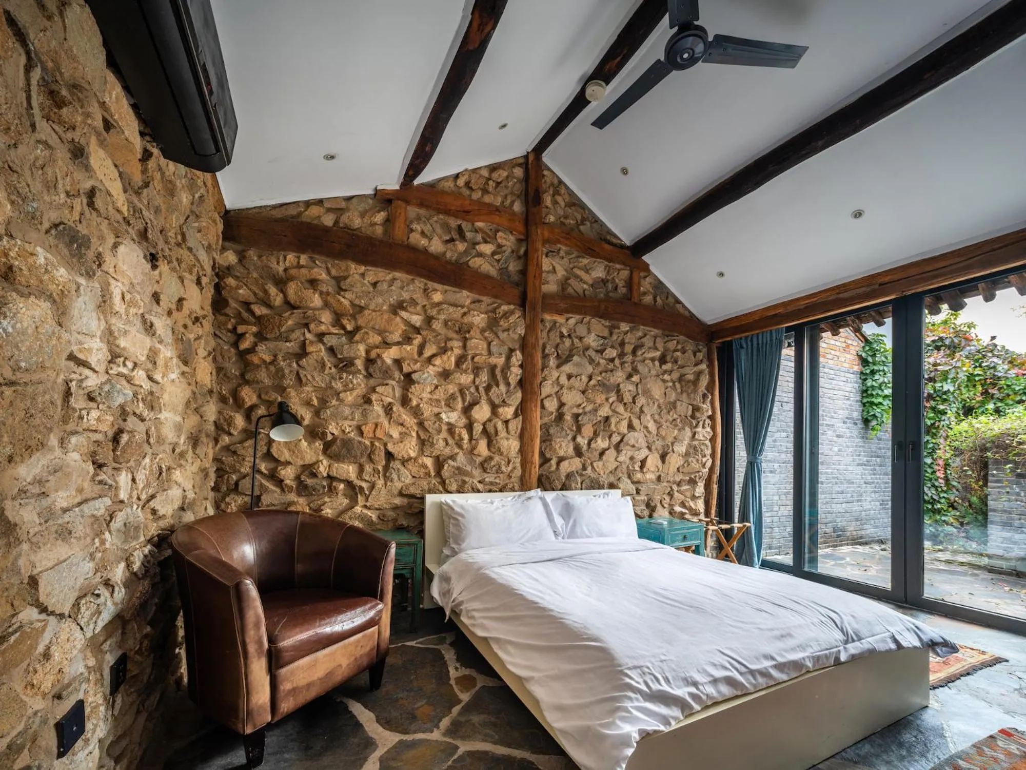 Bedroom, Bed in Brickyard Retreat at Mutianyu Great Wall Adjoin to Mutianyu Great Wall - Room with the View of Great Wall - Jacuzzi with the View of Great Wall - Vehicle Shuttle Service - International Catering - SPA& Nail Beauty Facilities