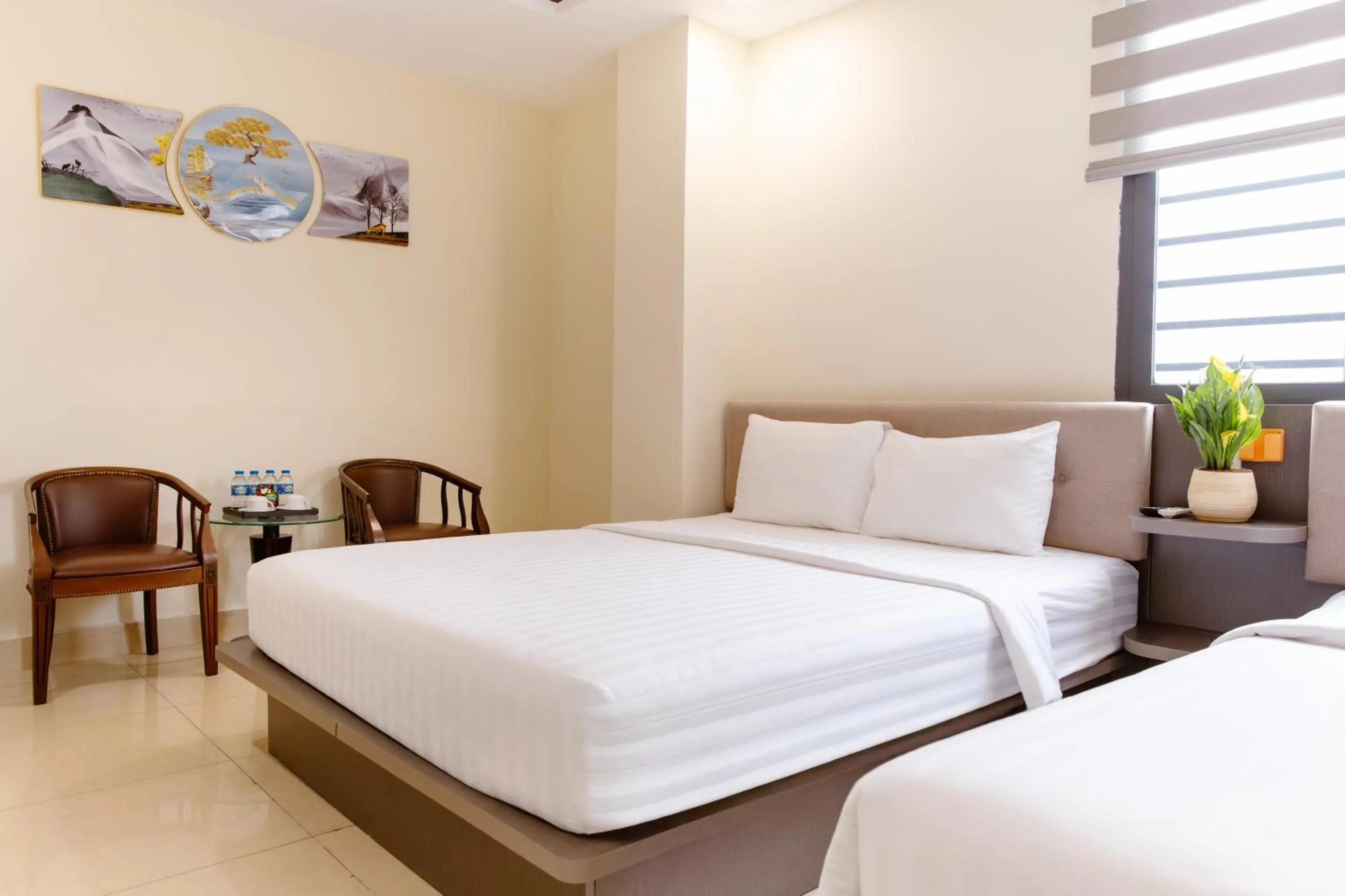 Bed in Boss Palace Hotel