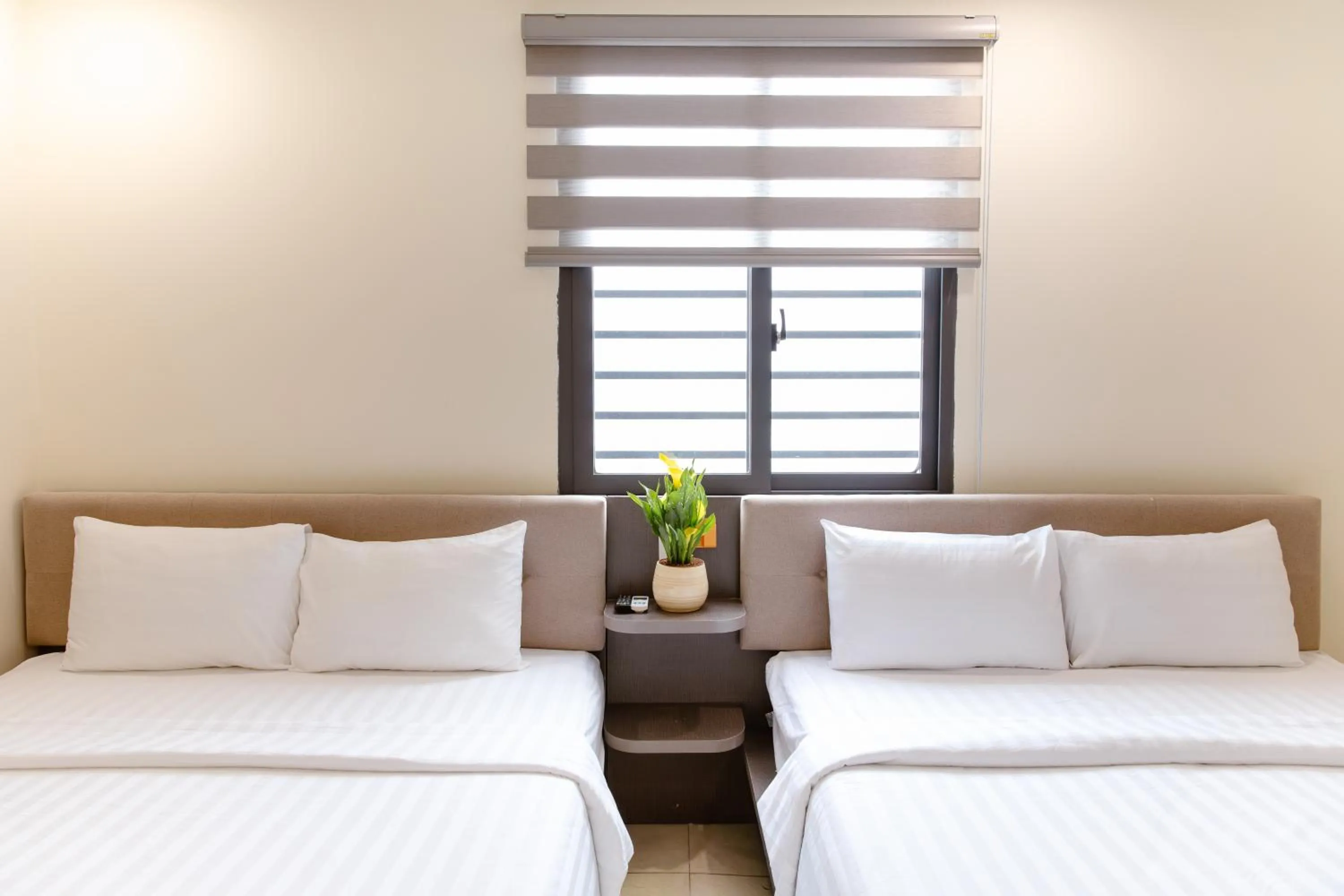 Bed in Boss Palace Hotel