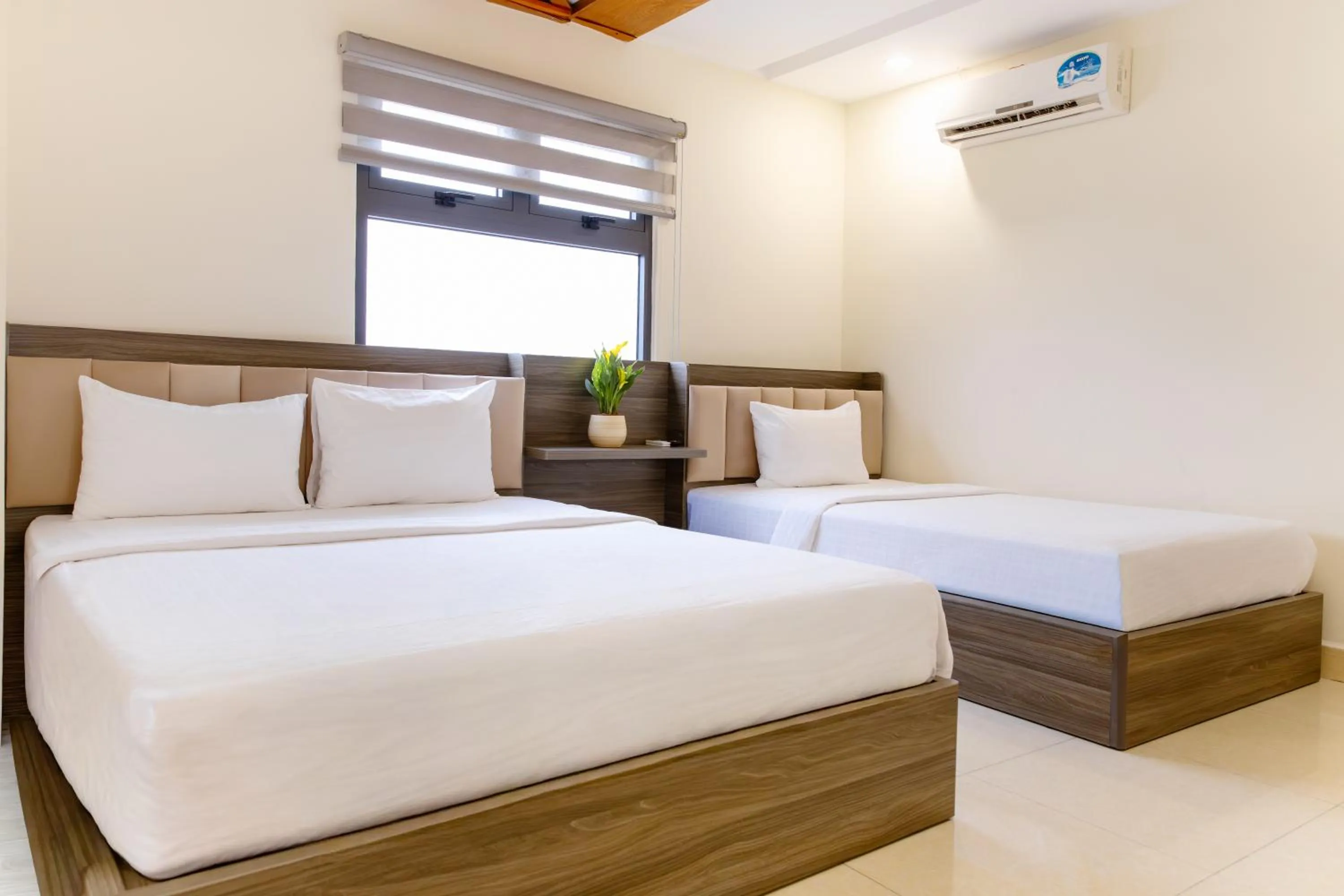 Bed in Boss Palace Hotel