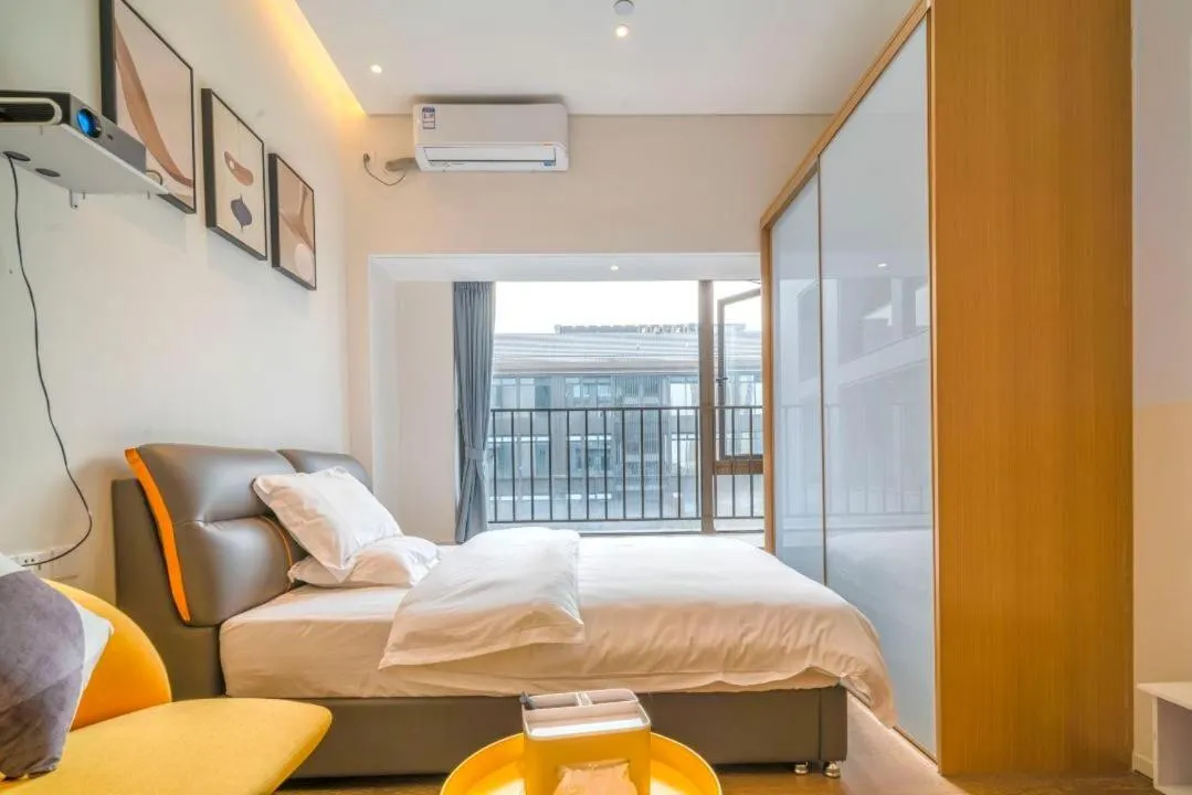 Bed in Guangzhou YuXiang Apartment - Guangzhou Pazhou International Convention and Exhibition Center