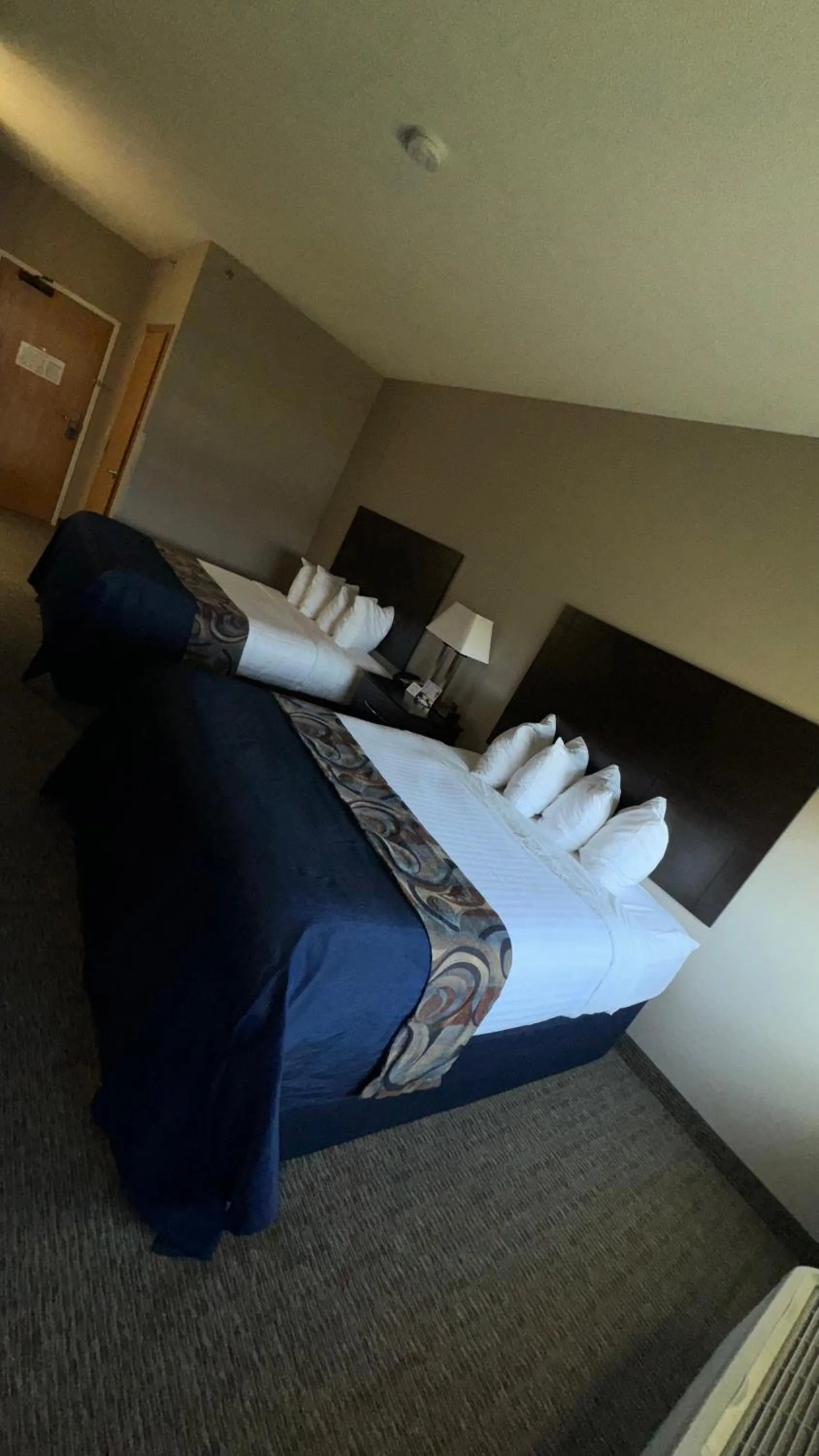 Bed in Garner INN & Suites