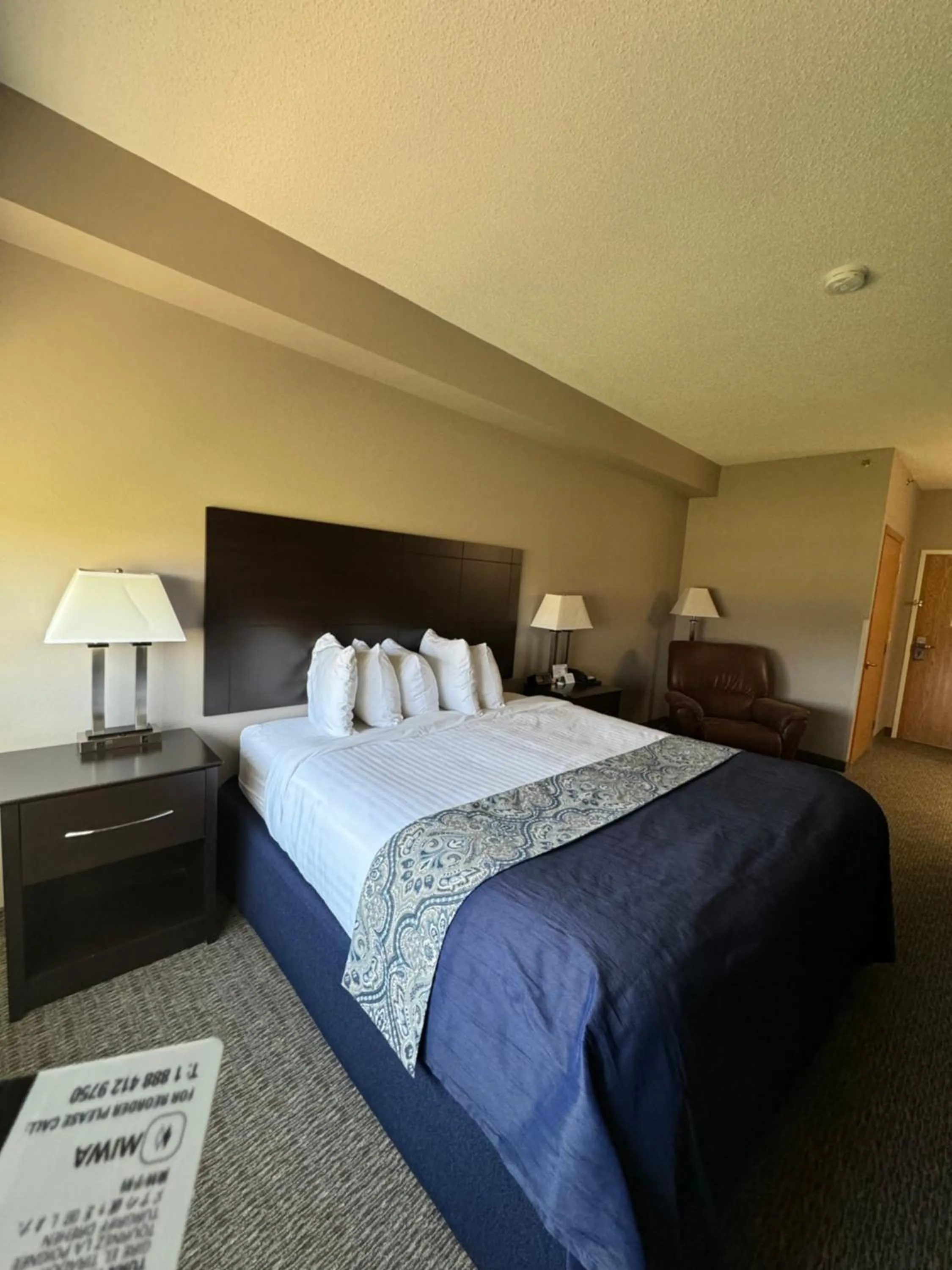 Bed in Garner INN & Suites