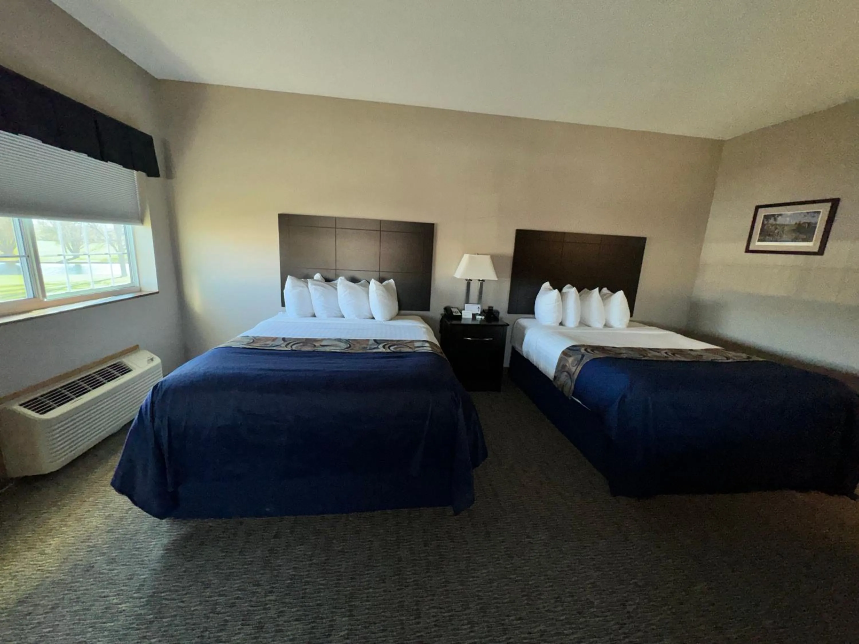 Bed in Garner INN & Suites