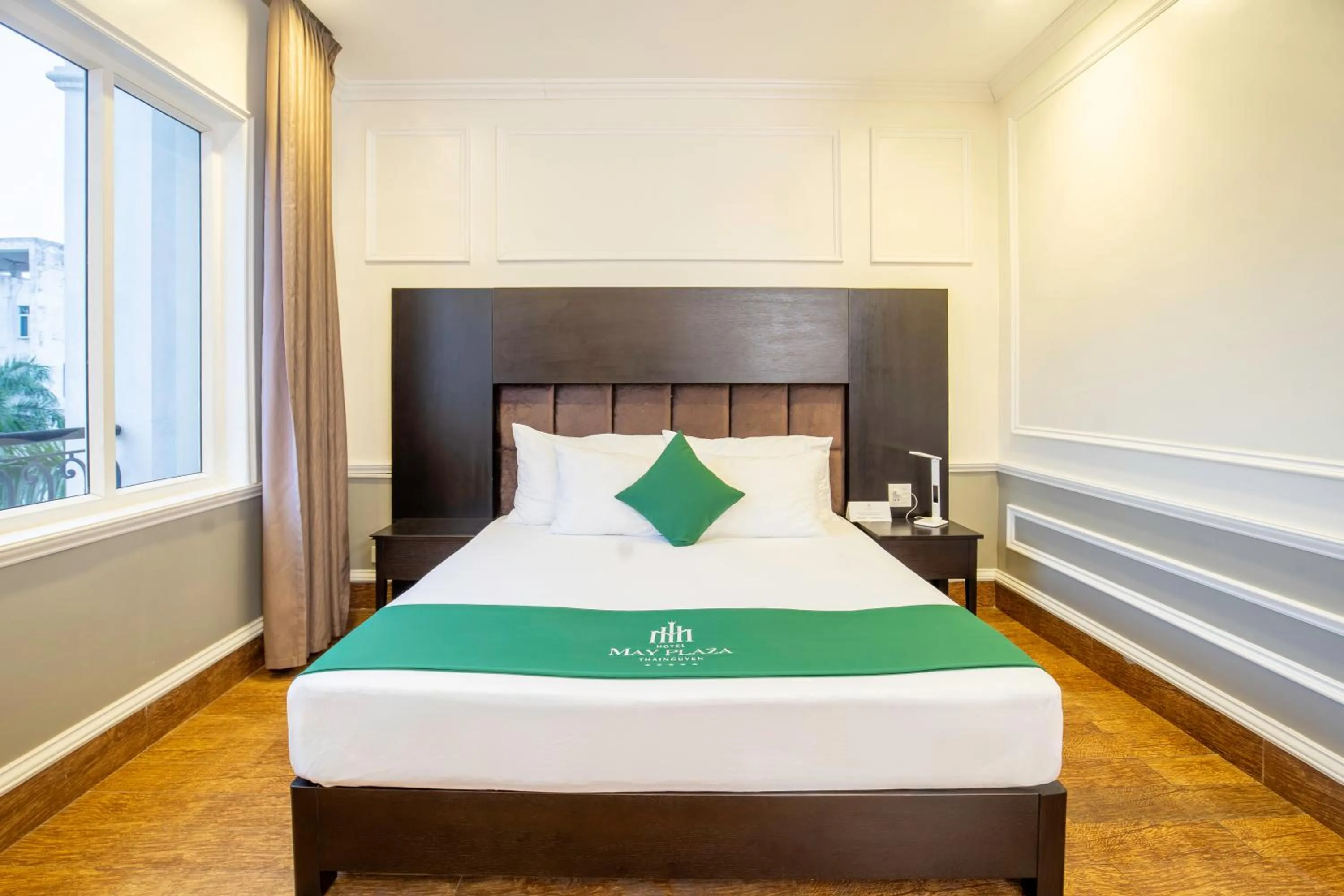 Bed in MAY PLAZA HOTEL