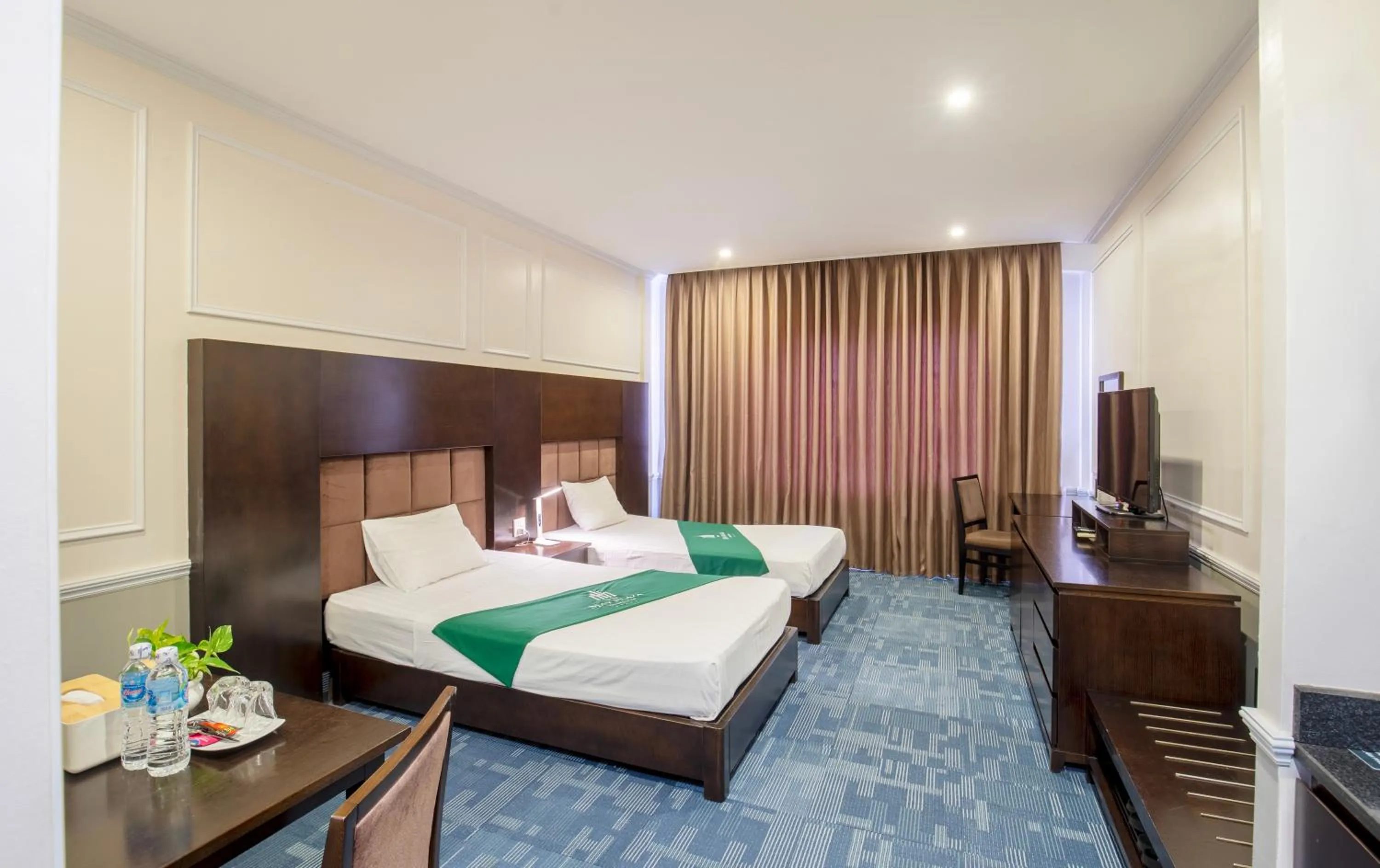 Bed in MAY PLAZA HOTEL