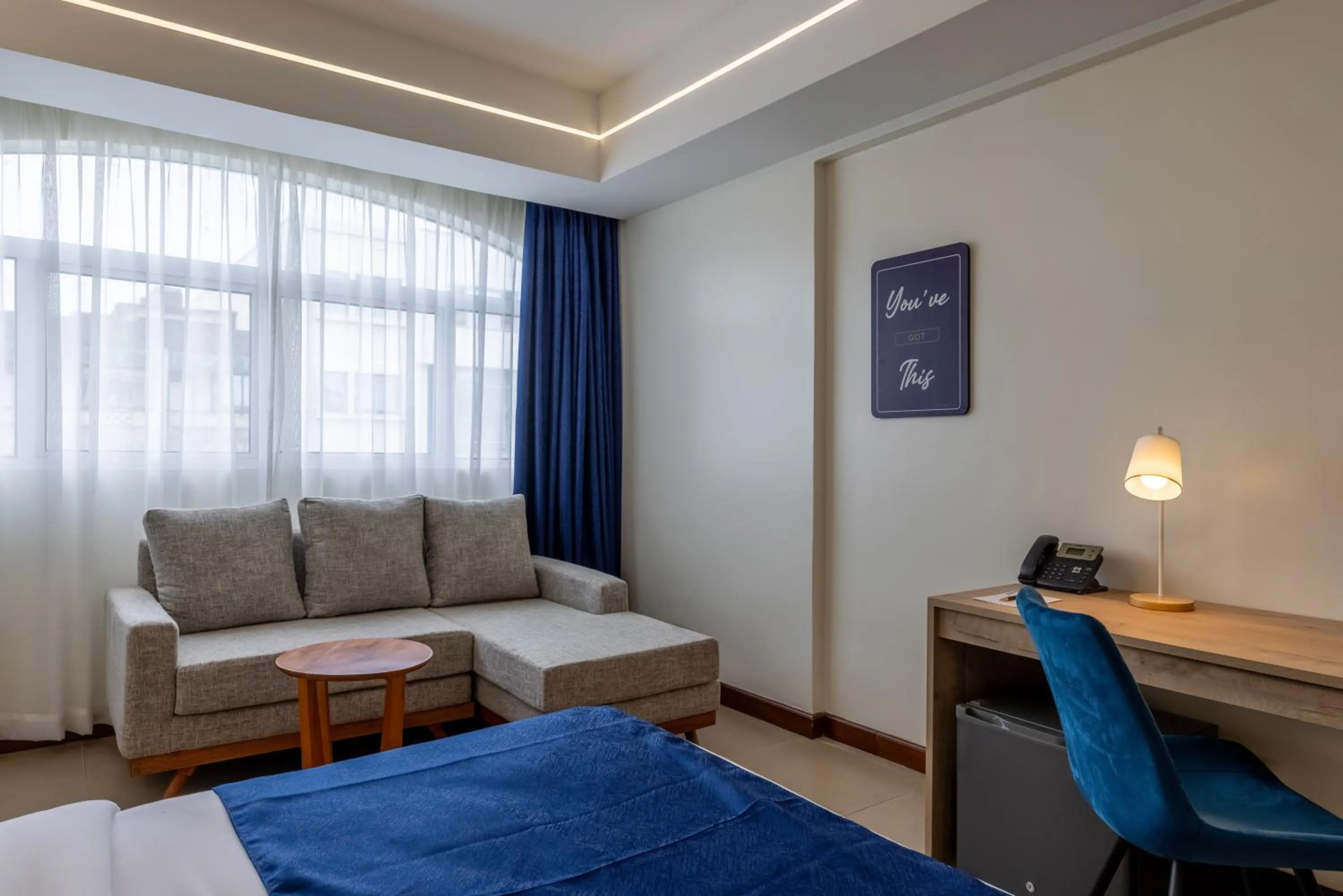 Seating area, Bed in Premium Inn Mombasa City