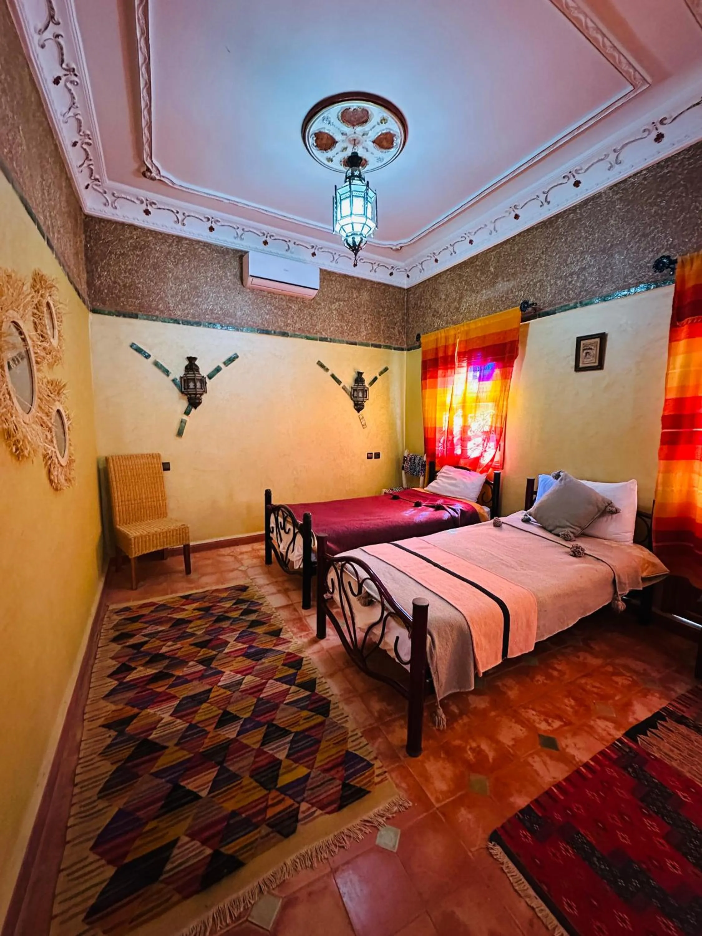 Bed in Riad Soleil du Monde