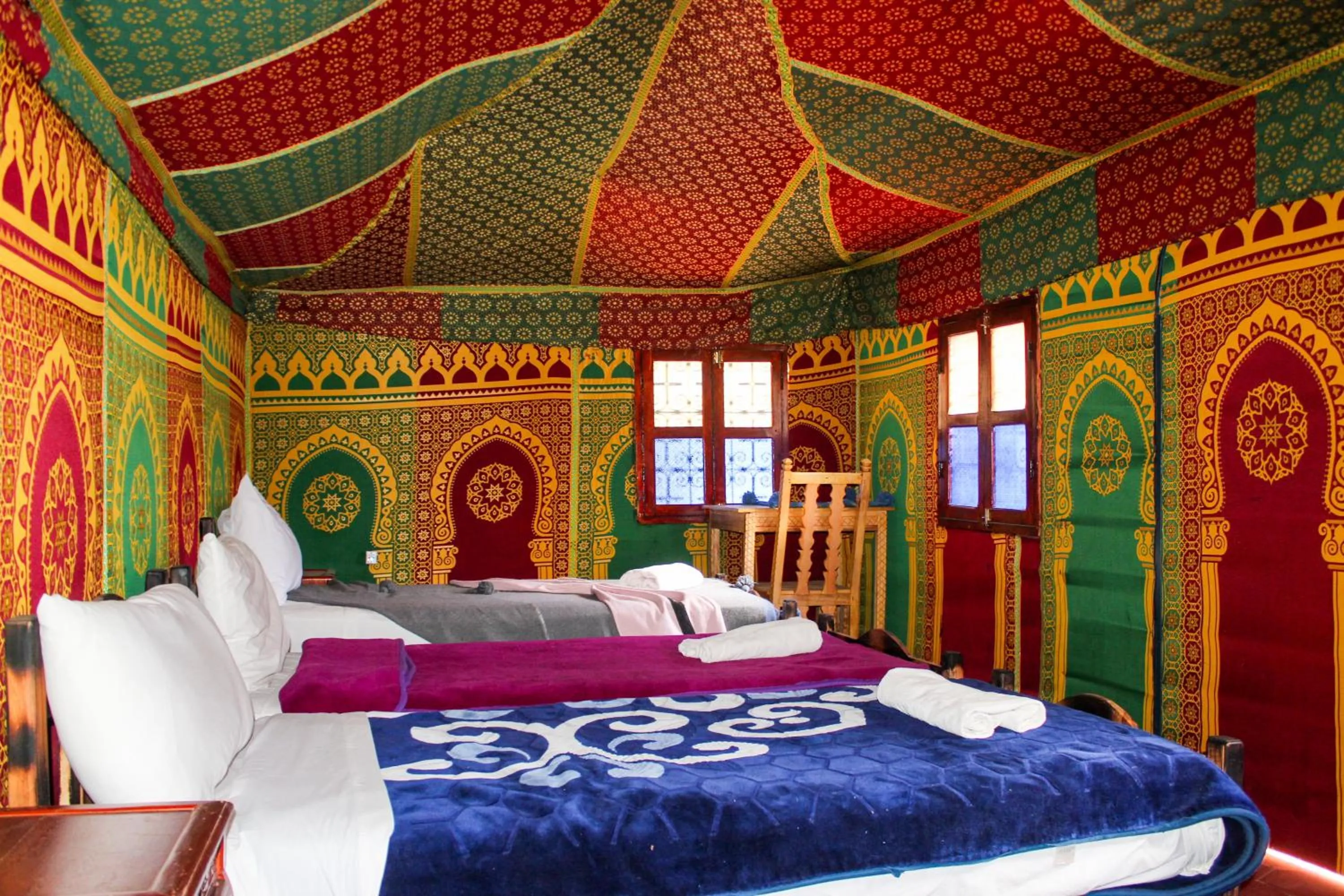 Bed in Riad Soleil du Monde