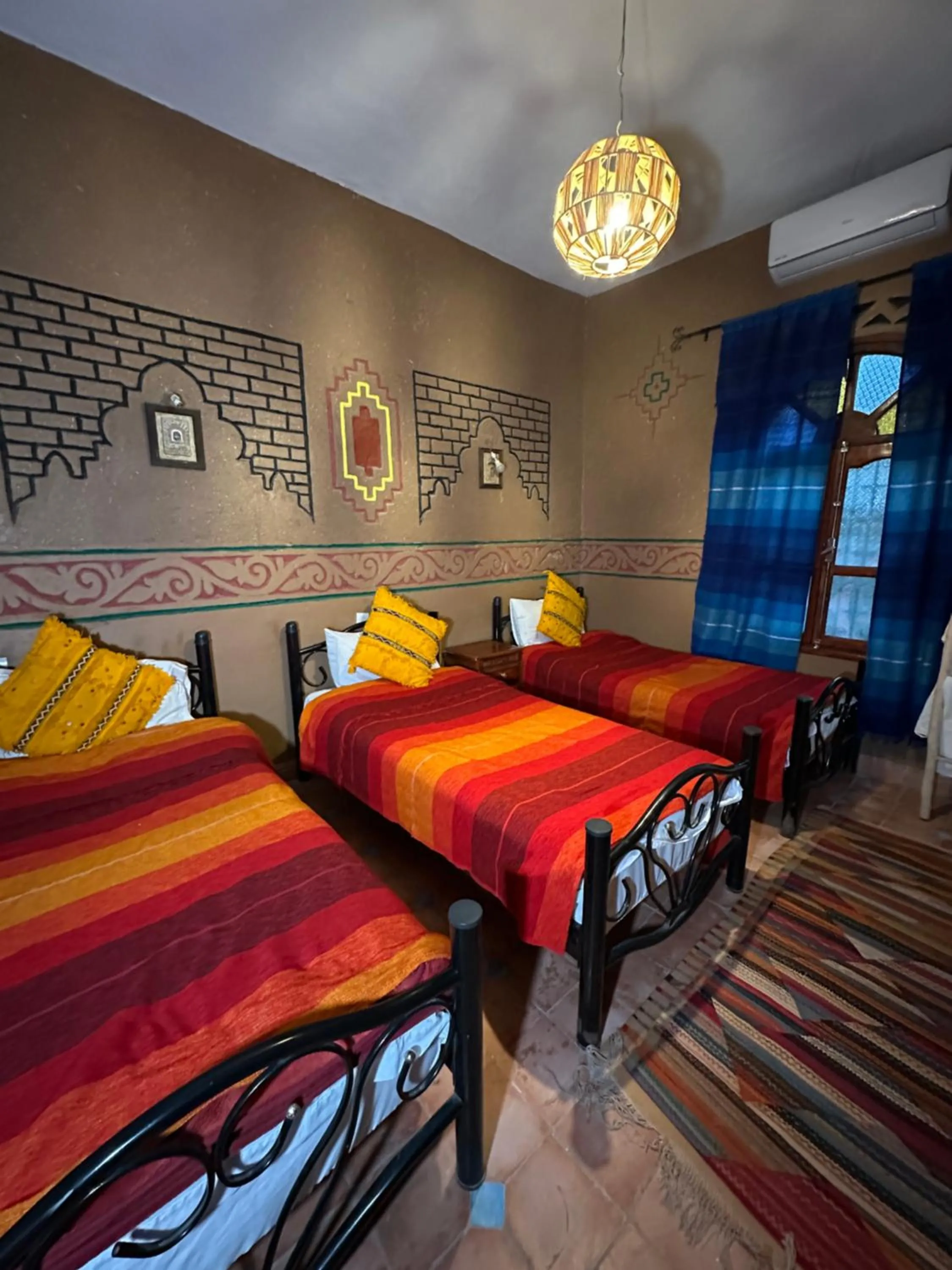 Bed in Riad Soleil du Monde