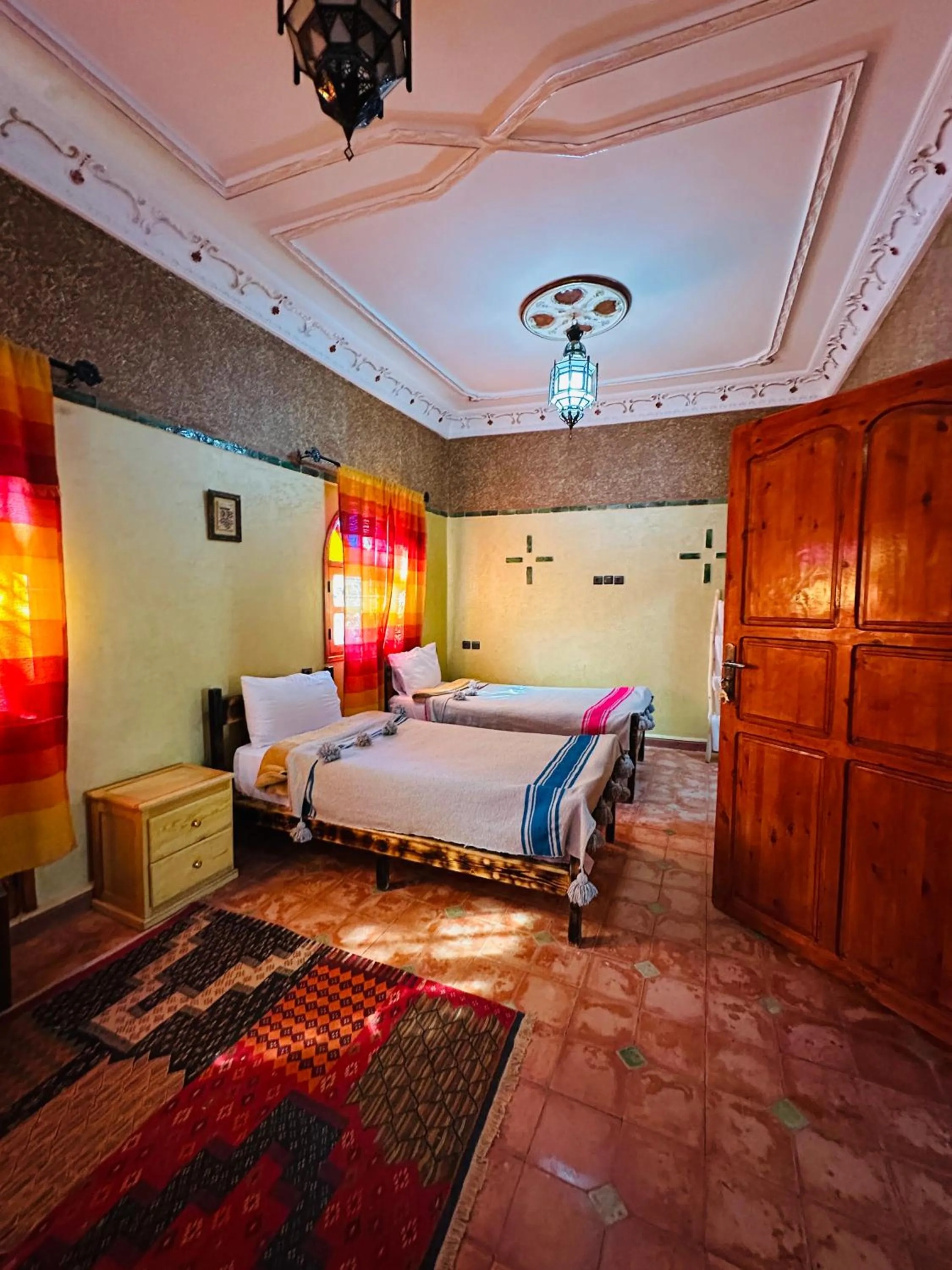 Bed in Riad Soleil du Monde