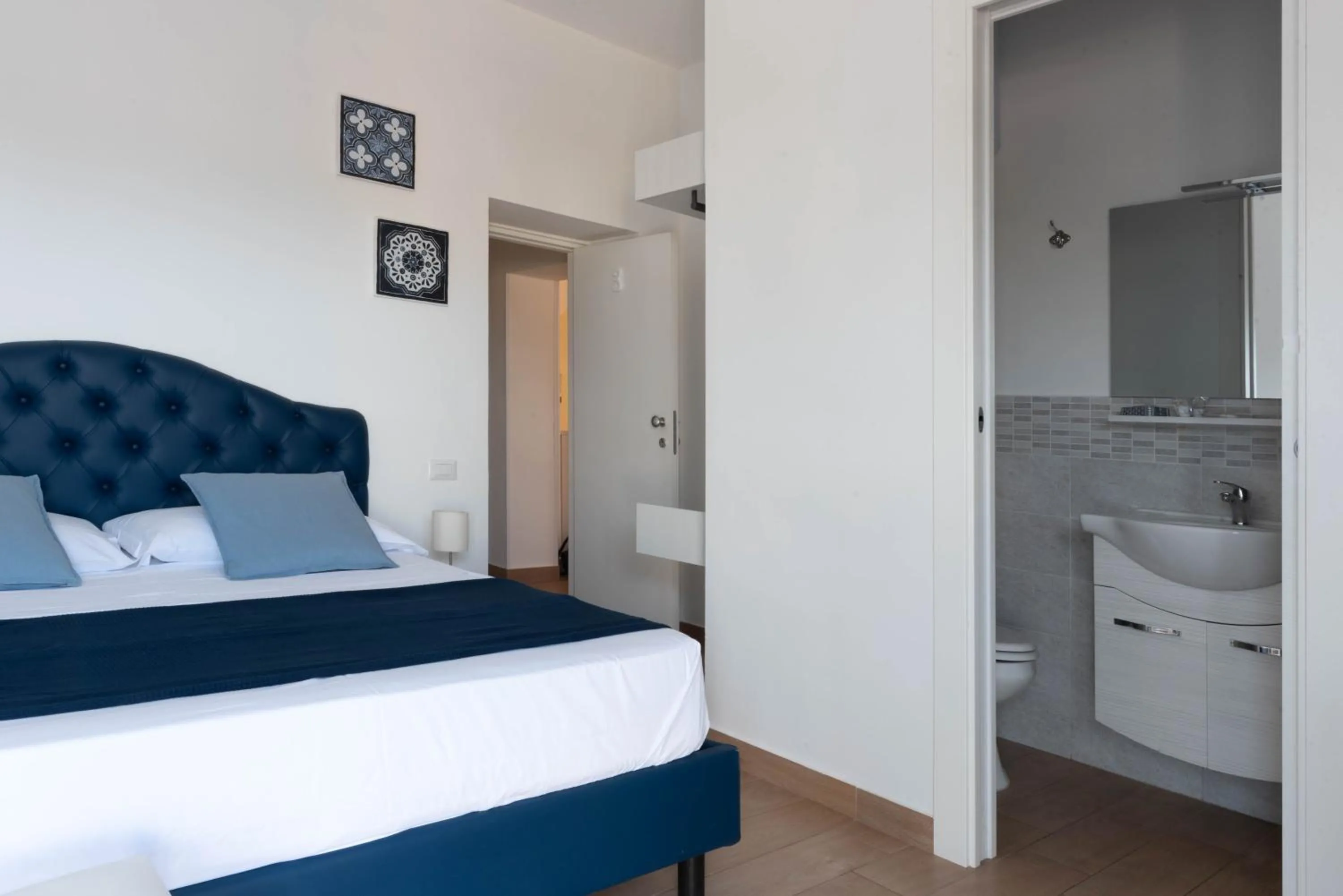 Bed in Sirentum Rooms