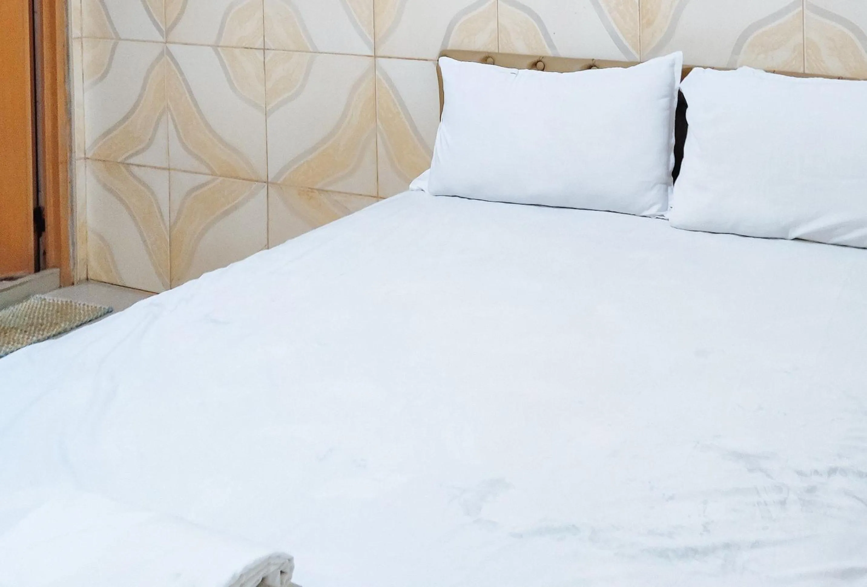 Bed in RedDoorz @ PVC Pension Haus