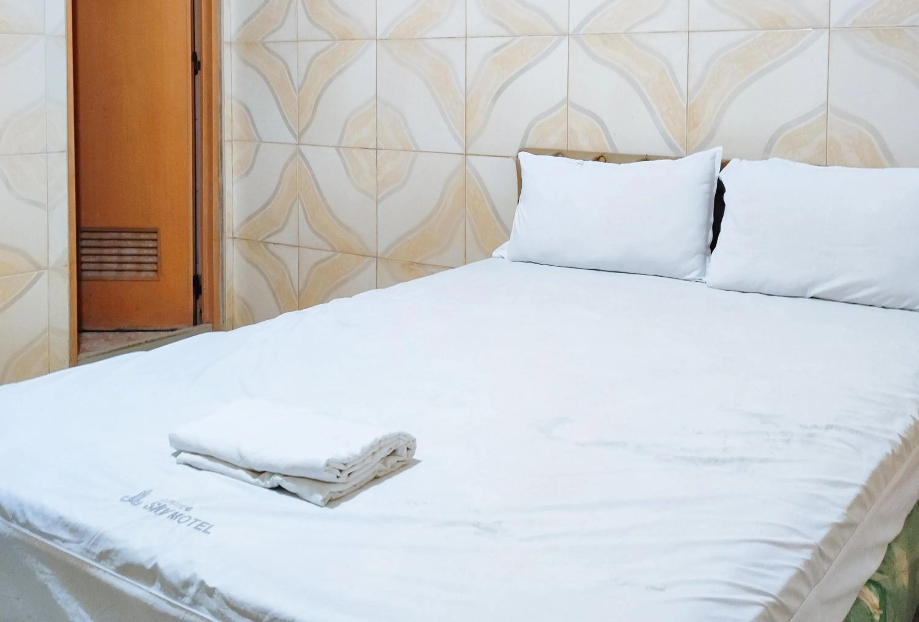 Bed in RedDoorz @ PVC Pension Haus