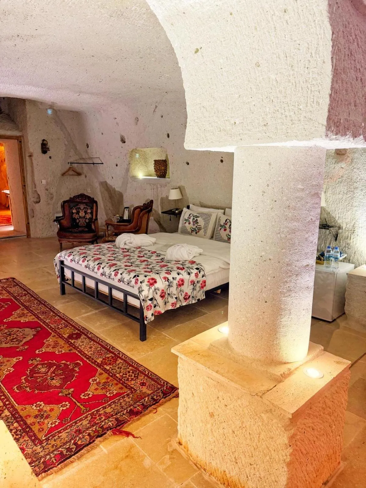 Seating area, Bed in My Cave Suites