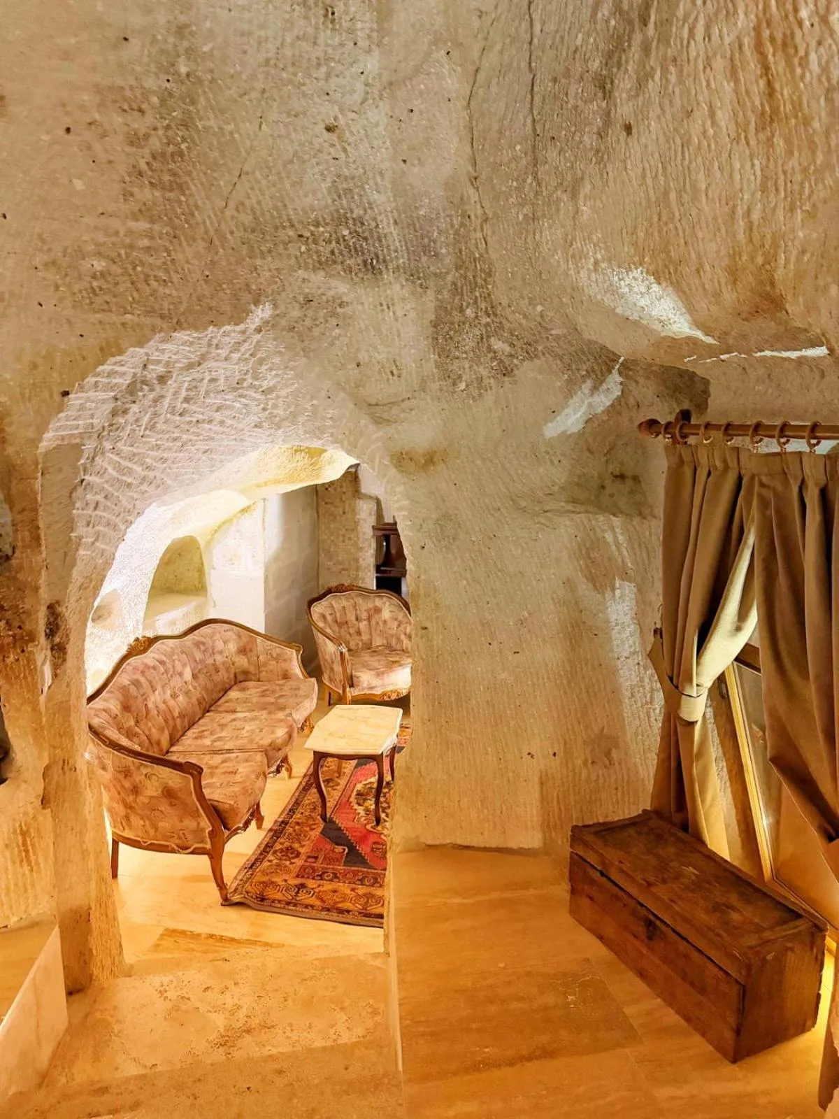 Seating area, Bed in My Cave Suites