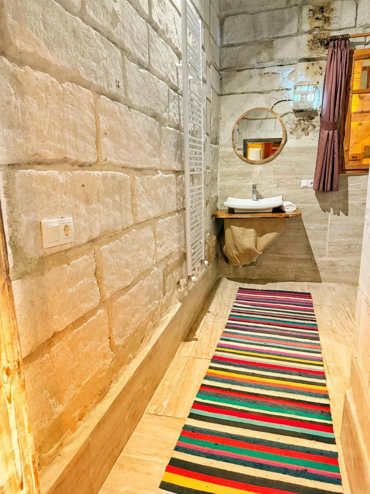 Bathroom in My Cave Suites