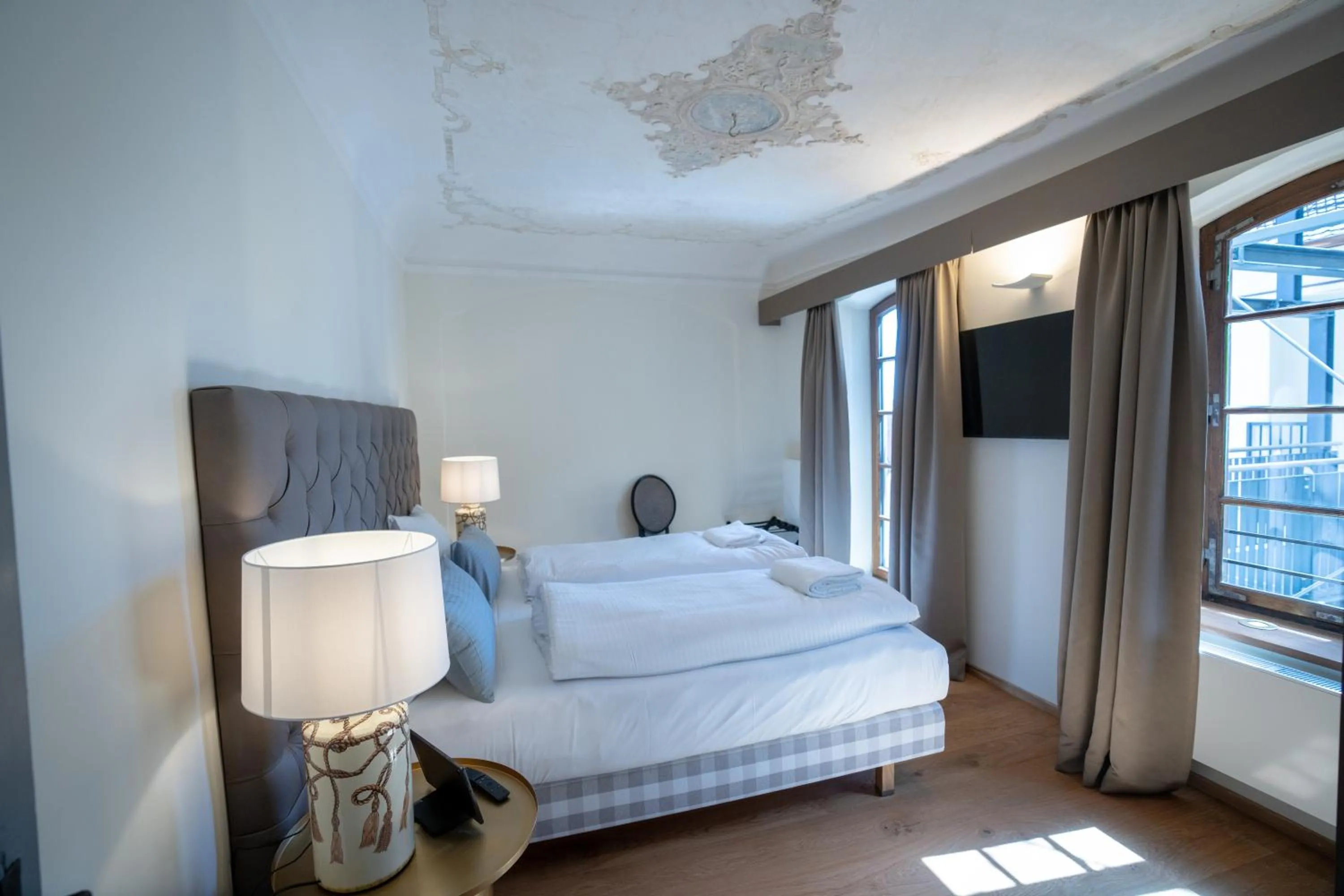 Photo of the whole room, Bed in Maxim Suites by Elias Holl