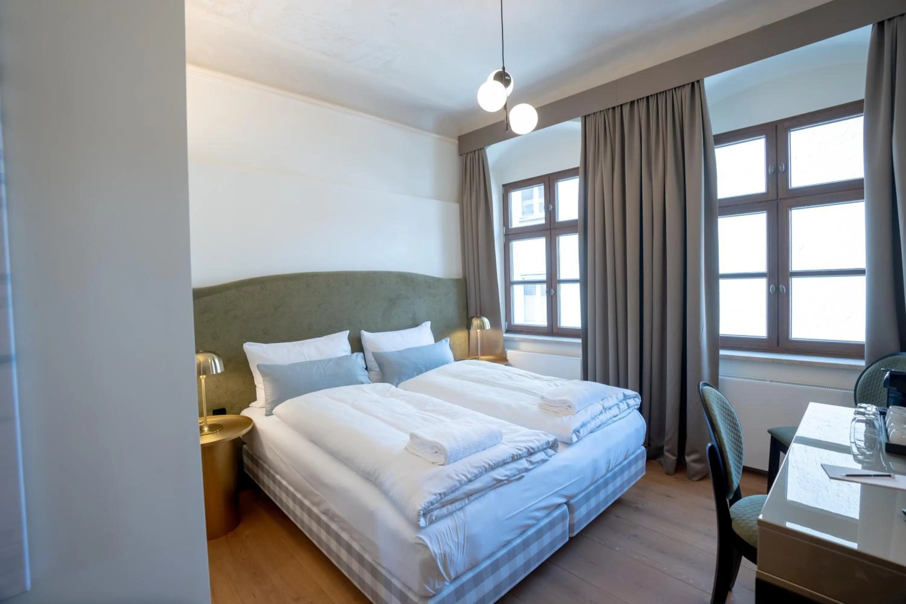 Photo of the whole room, Bed in Maxim Suites by Elias Holl