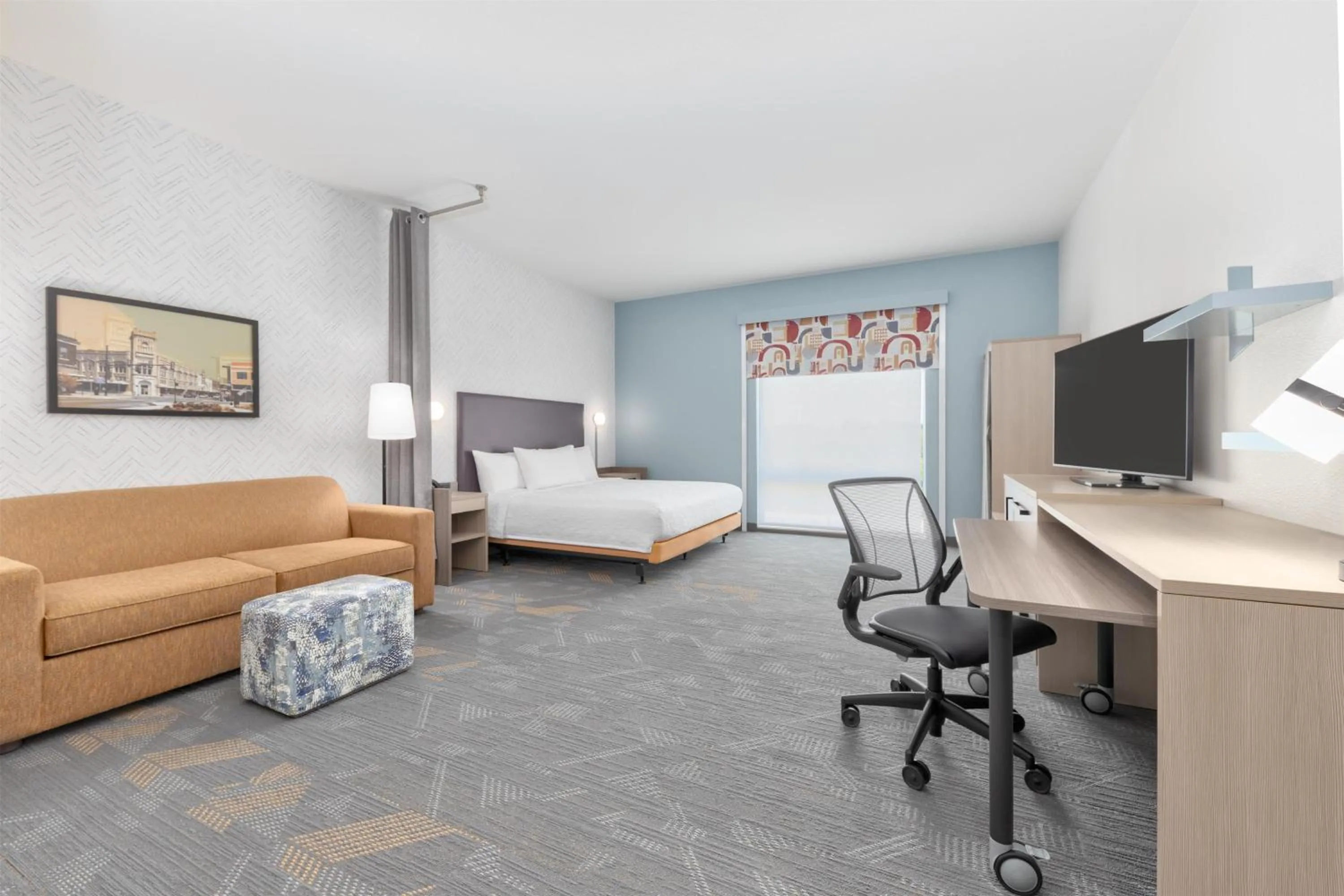 Living room, Bed in Home2 Suites By Hilton Paris