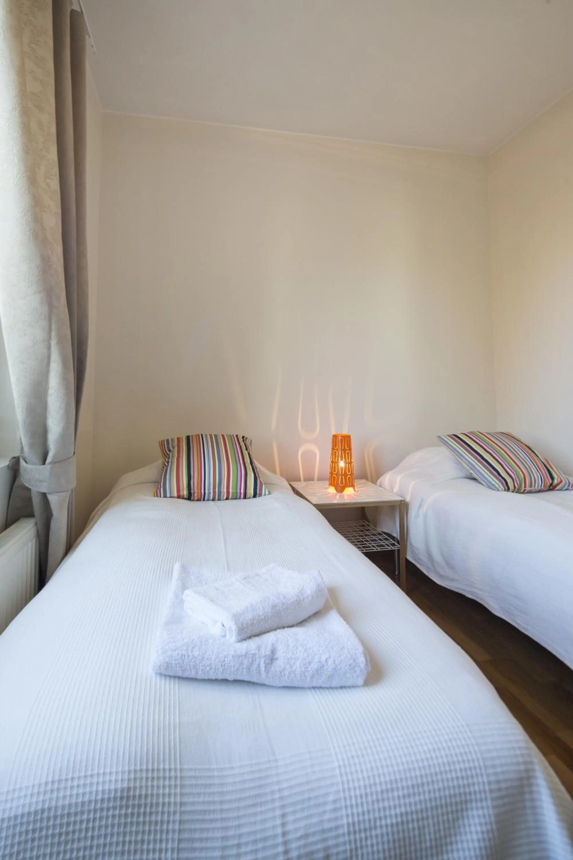 Bed in Kotimaailma Apartments Rovaniemi