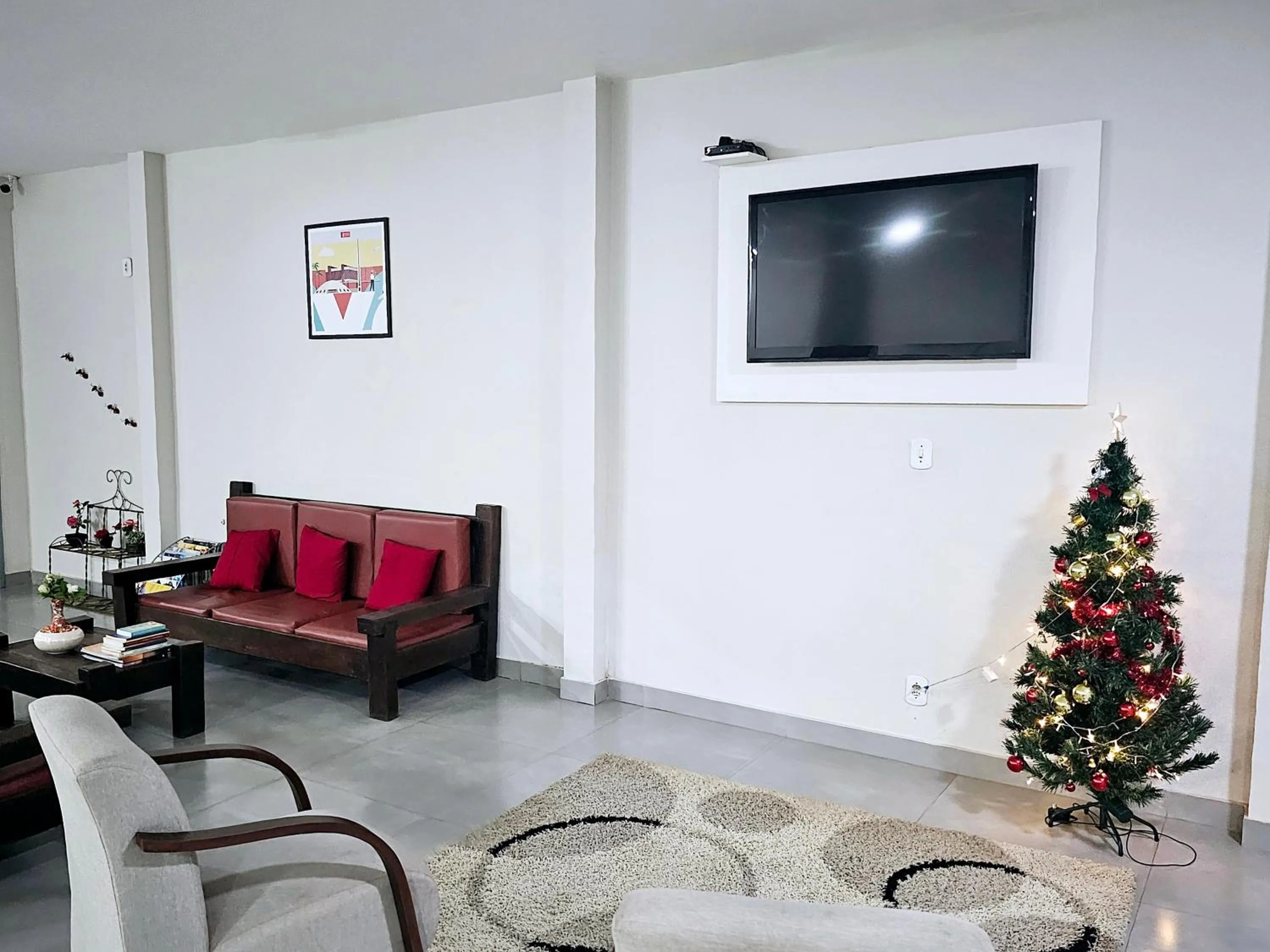 Communal lounge/ TV room in HOTEL INDIANO