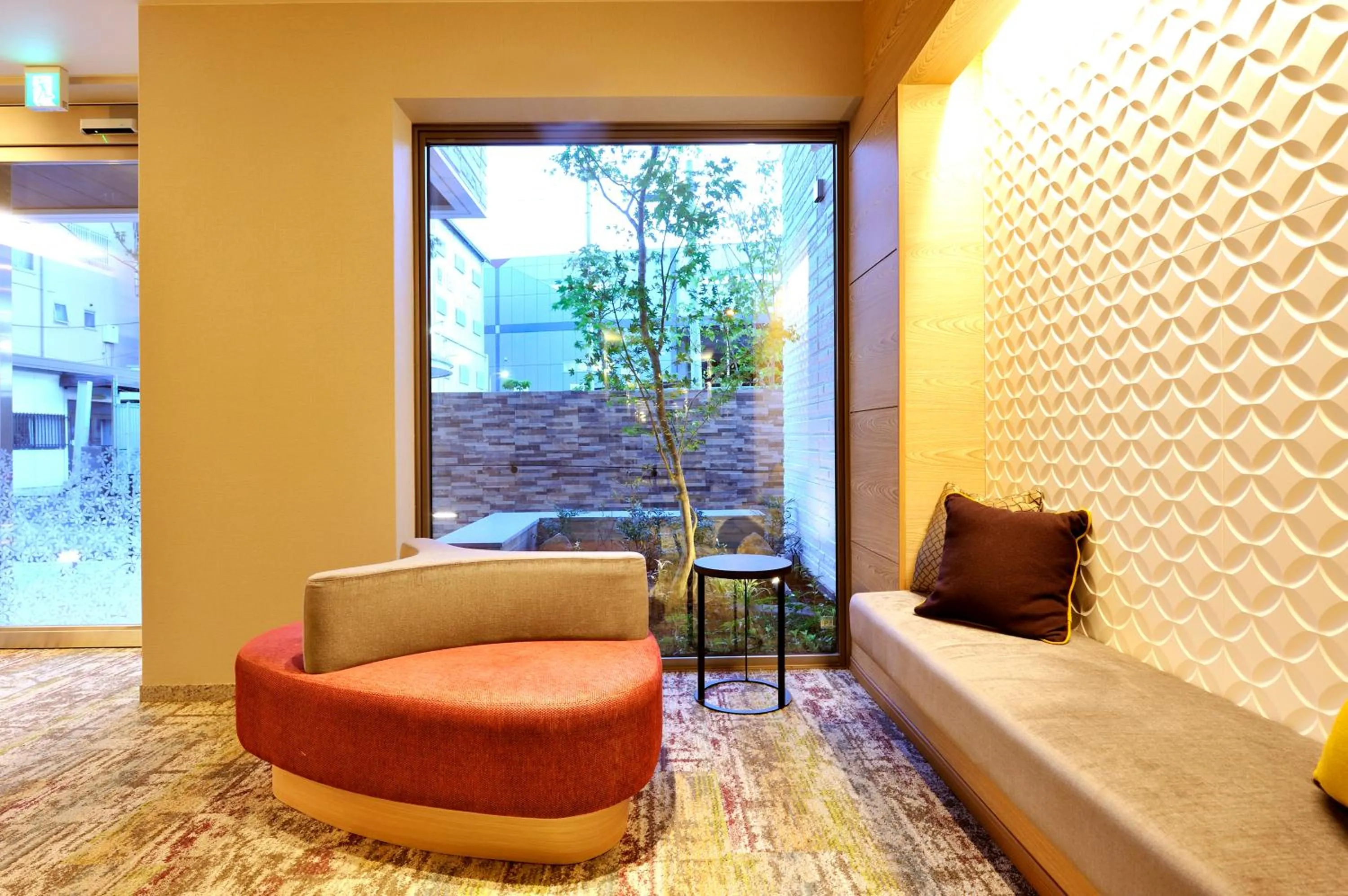 Seating area in Rakuten STAY x Shamaison Osaka Dekijima Station