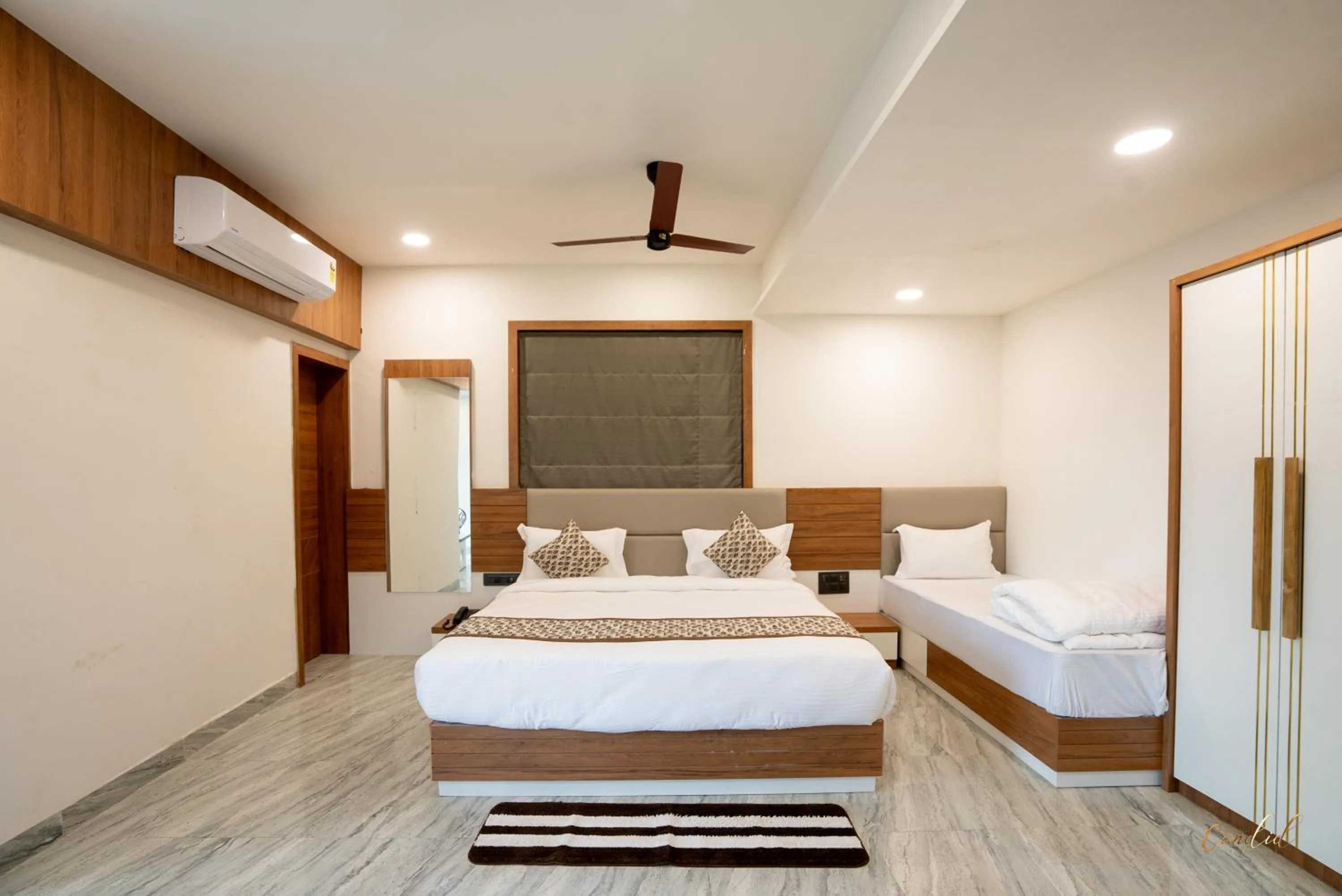 Photo of the whole room, Bed in Daksh Eden Greenz -A Luxury Resort in Sasan Gir
