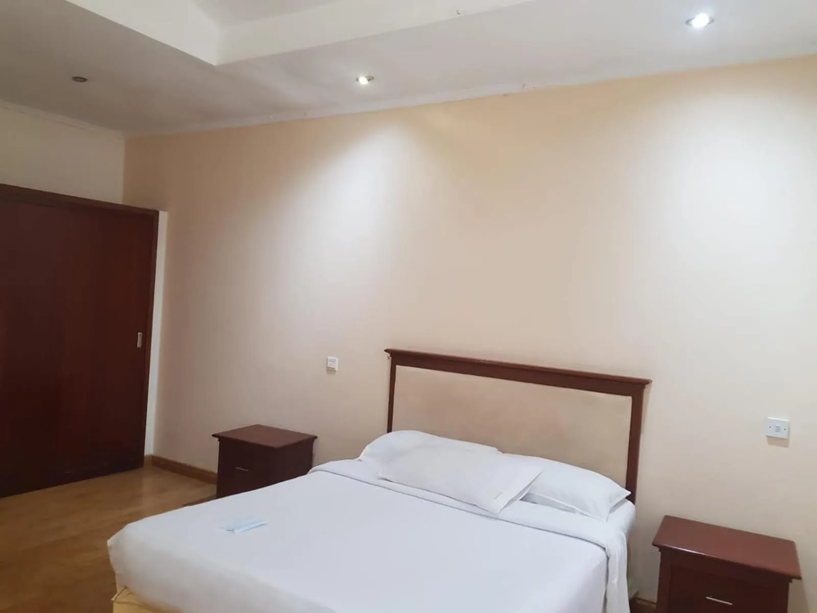 Bed in Natural Oak Apartments