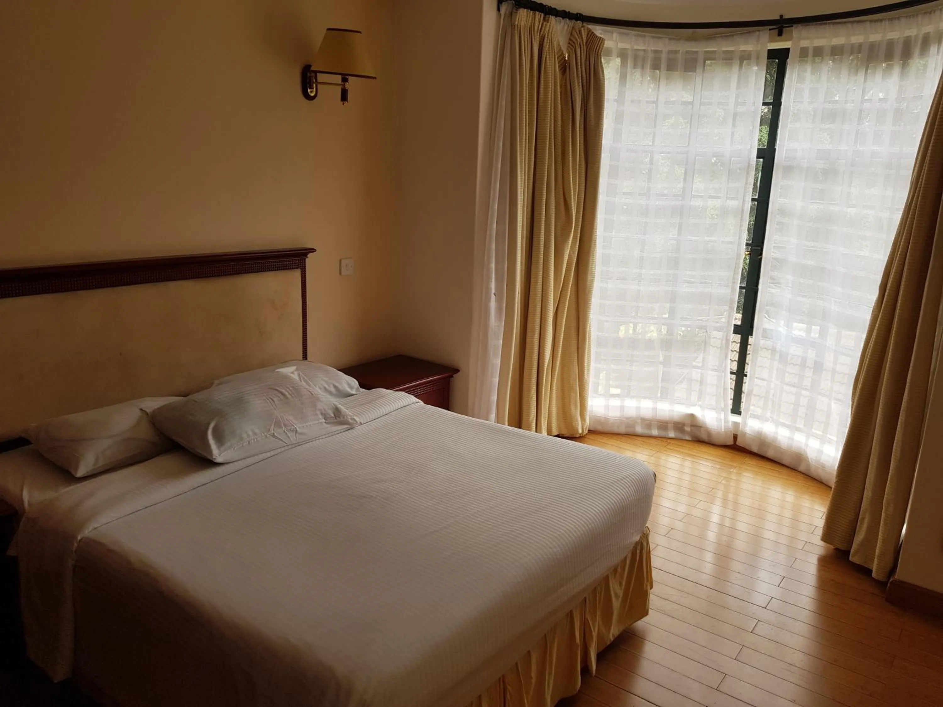 Bed in Natural Oak Apartments