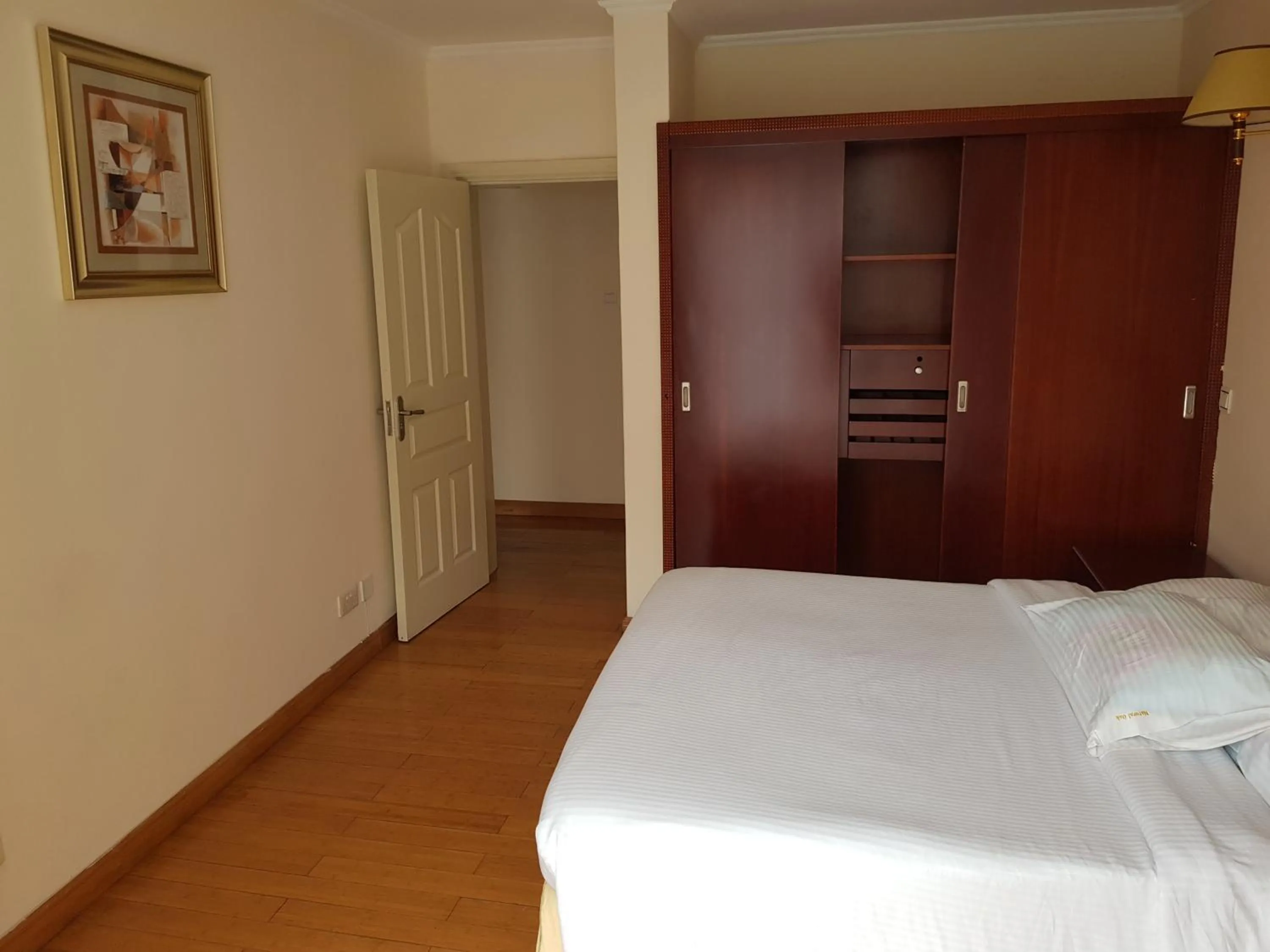 Bed in Natural Oak Apartments