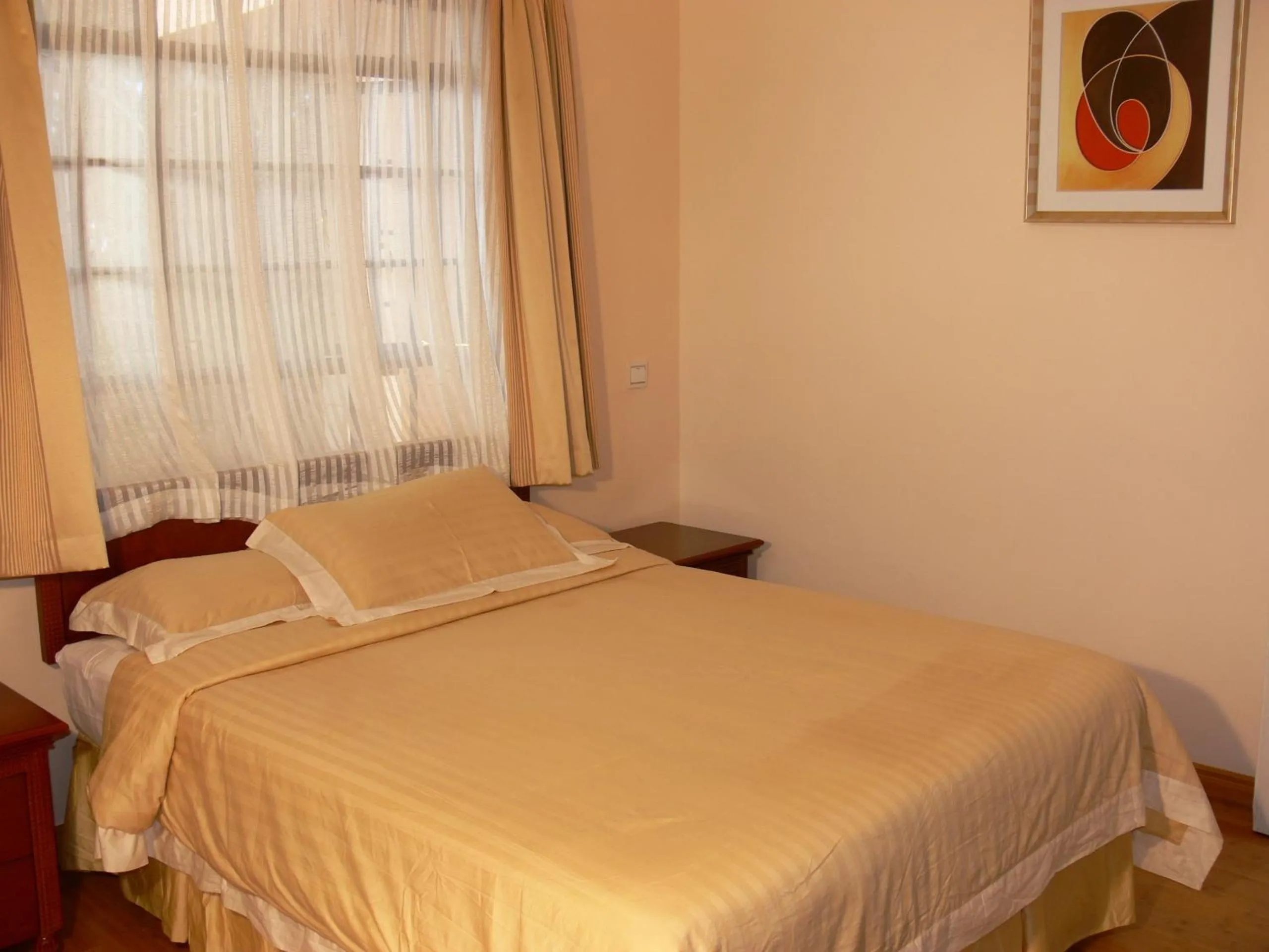 Bed in Natural Oak Apartments