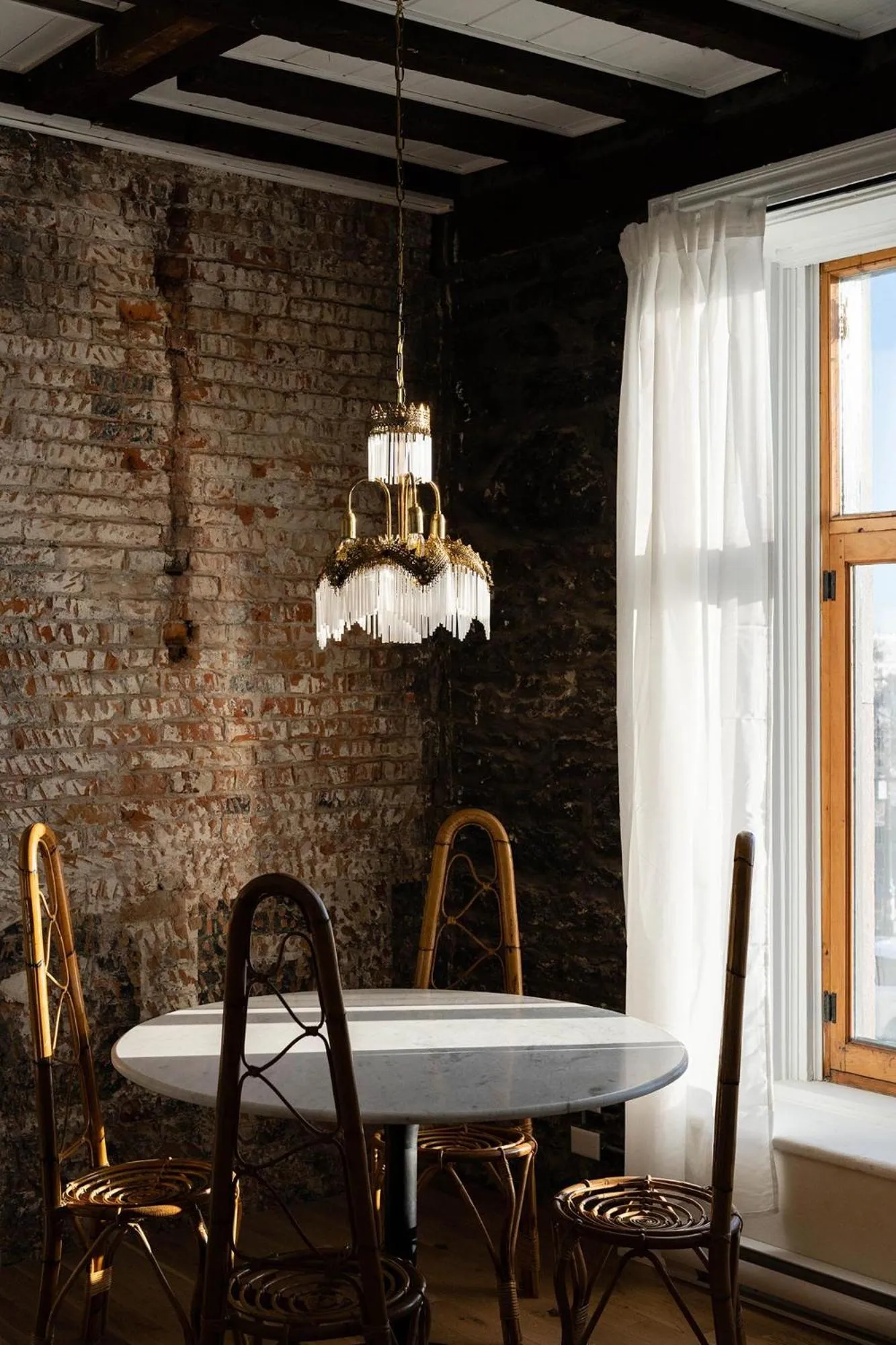 Dining area in Maison Place Royale by Luxury In Transit