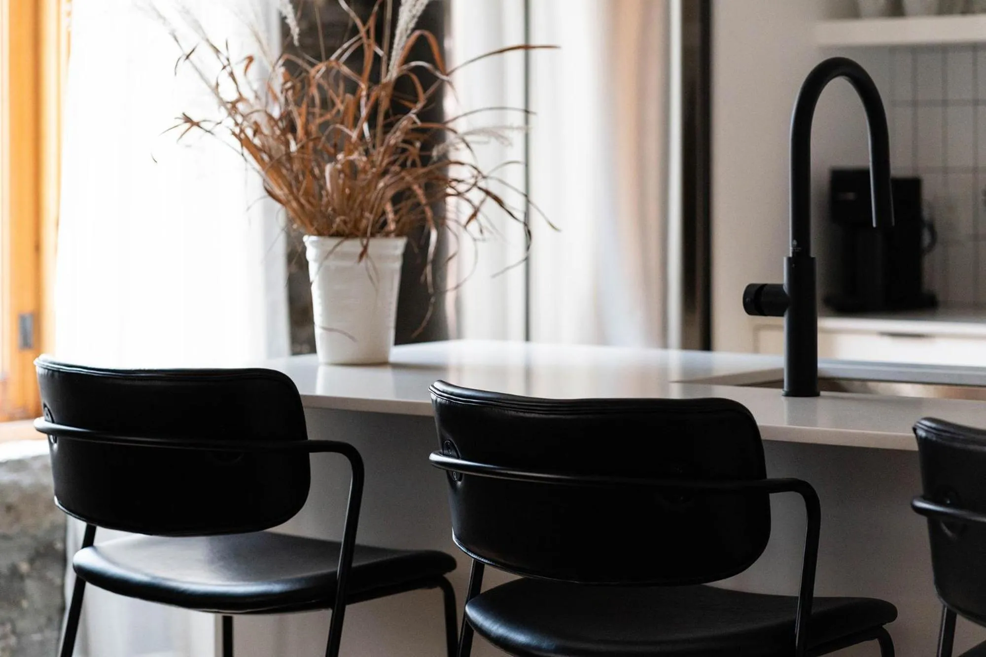 Seating area in Maison Place Royale by Luxury In Transit