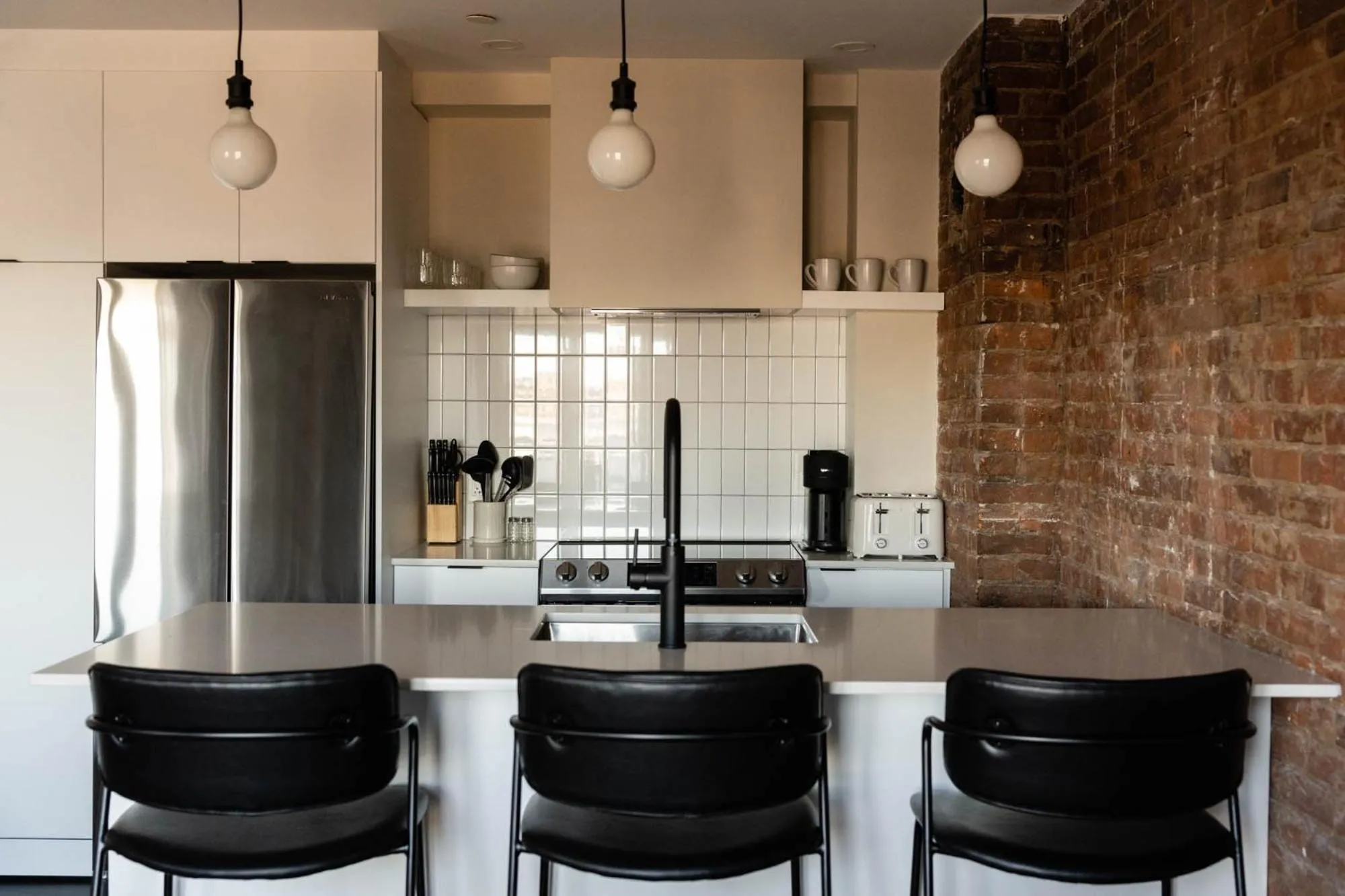 Kitchen or kitchenette in Maison Place Royale by Luxury In Transit