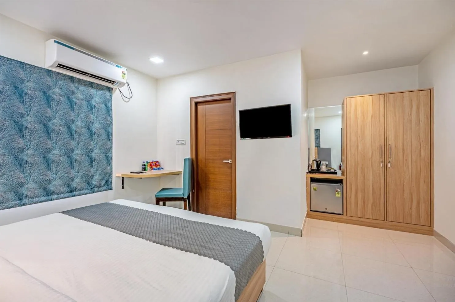 Bed in Eminent Suites and Apartments