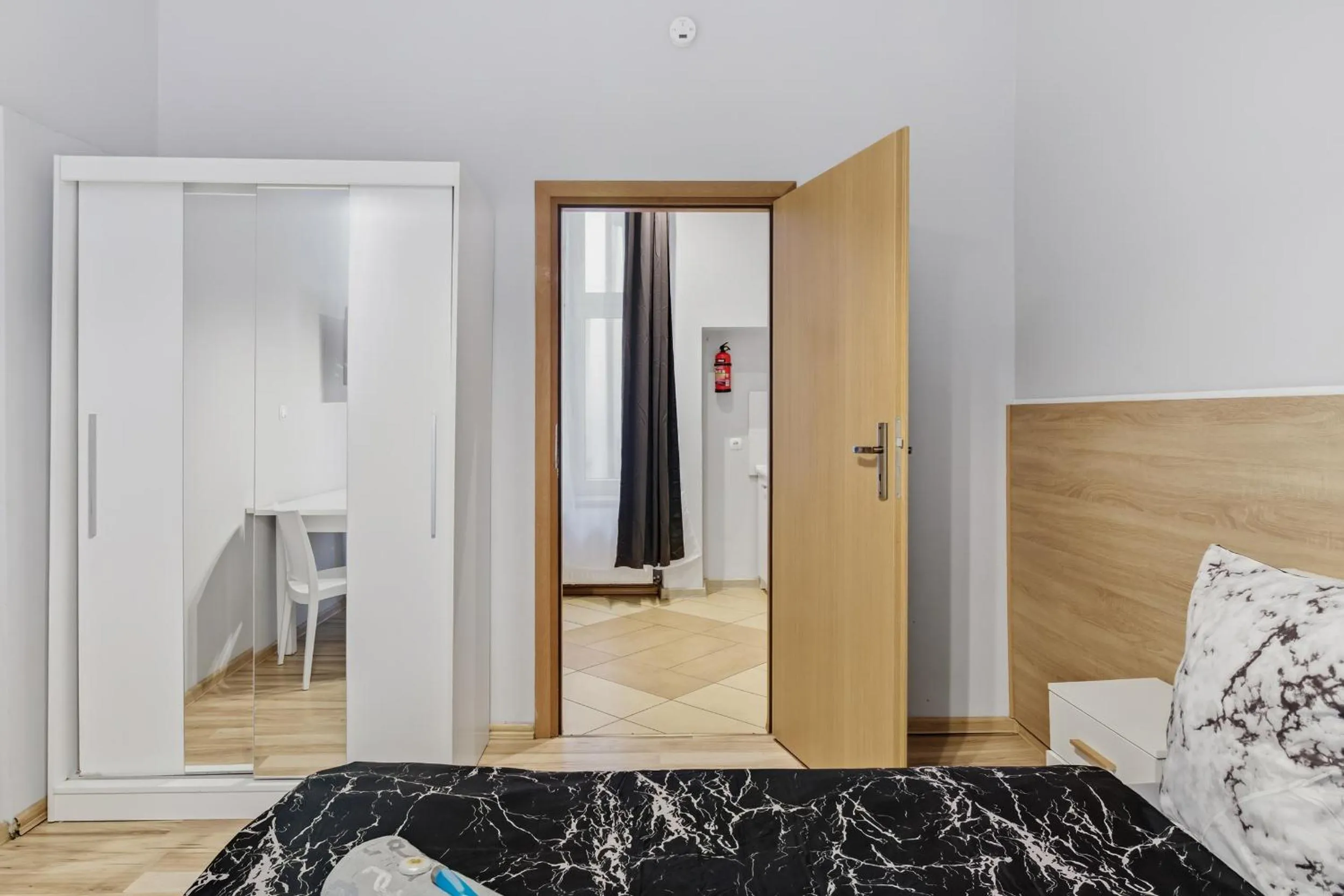 wardrobe, Bed in Queen Apartments