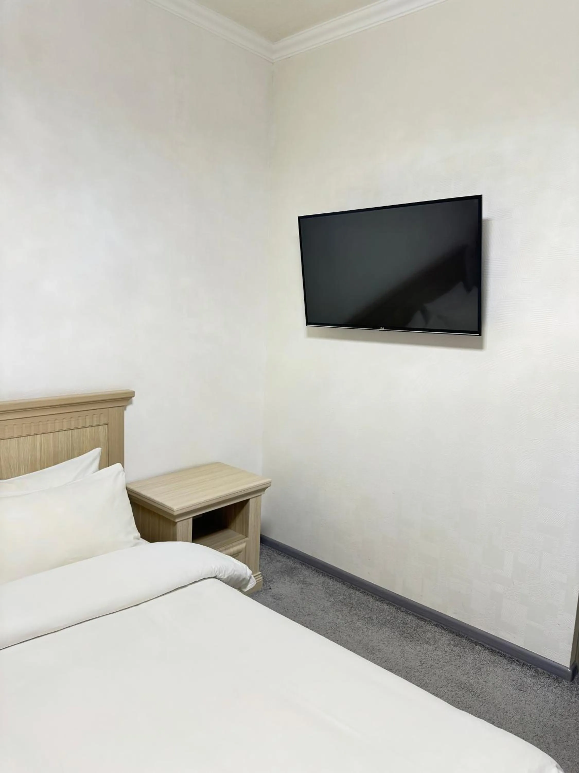 Bed in Alexander Hotel