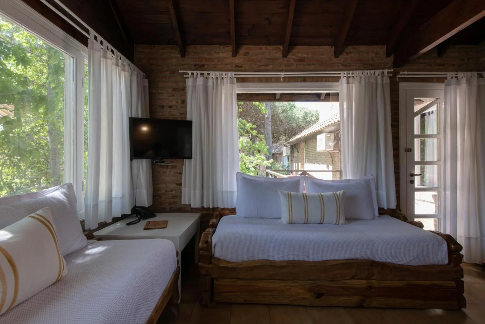 Bed in Carilo Village Apart Hotel & Spa