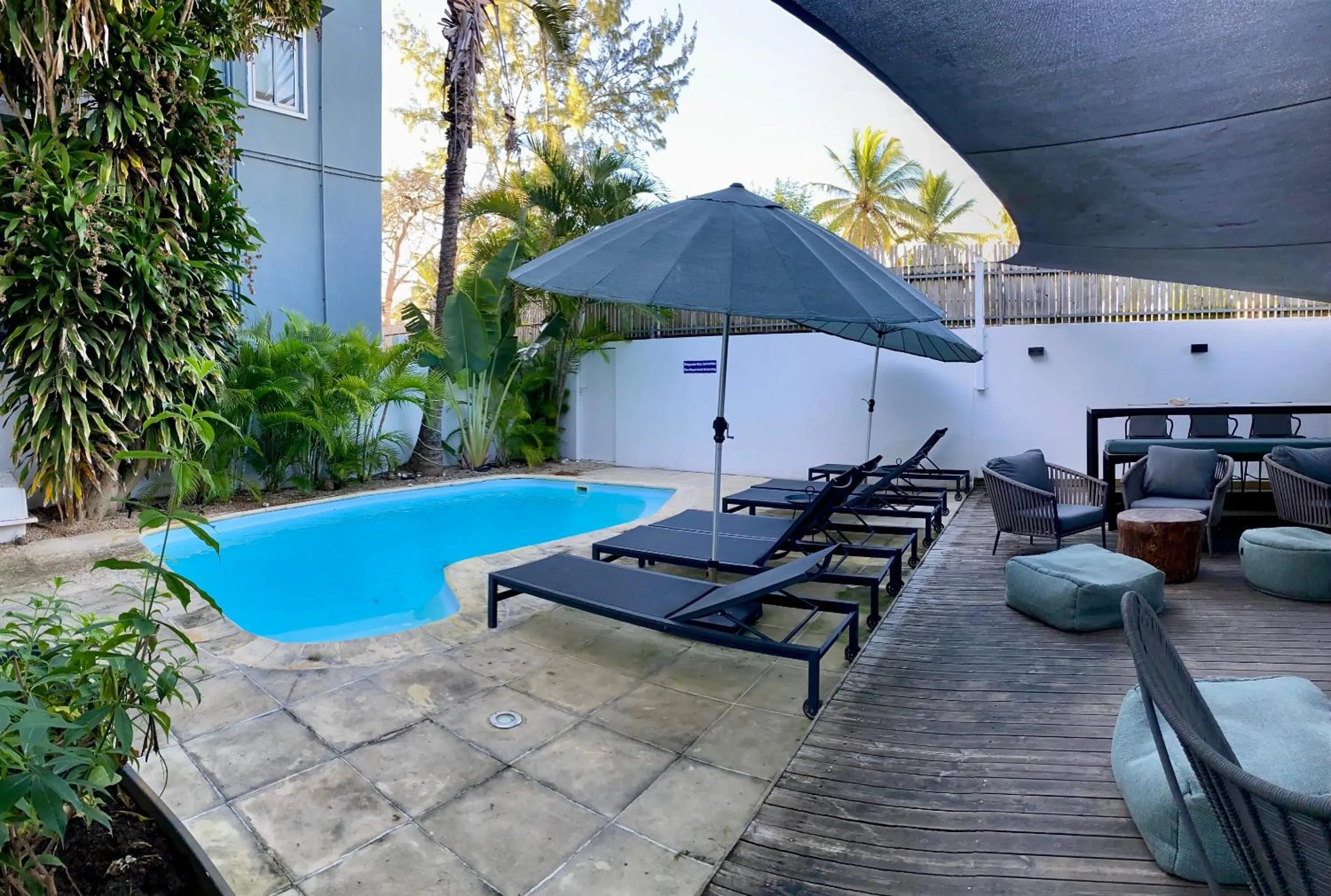 Swimming pool in Cosy Guest House Sous le Badamier