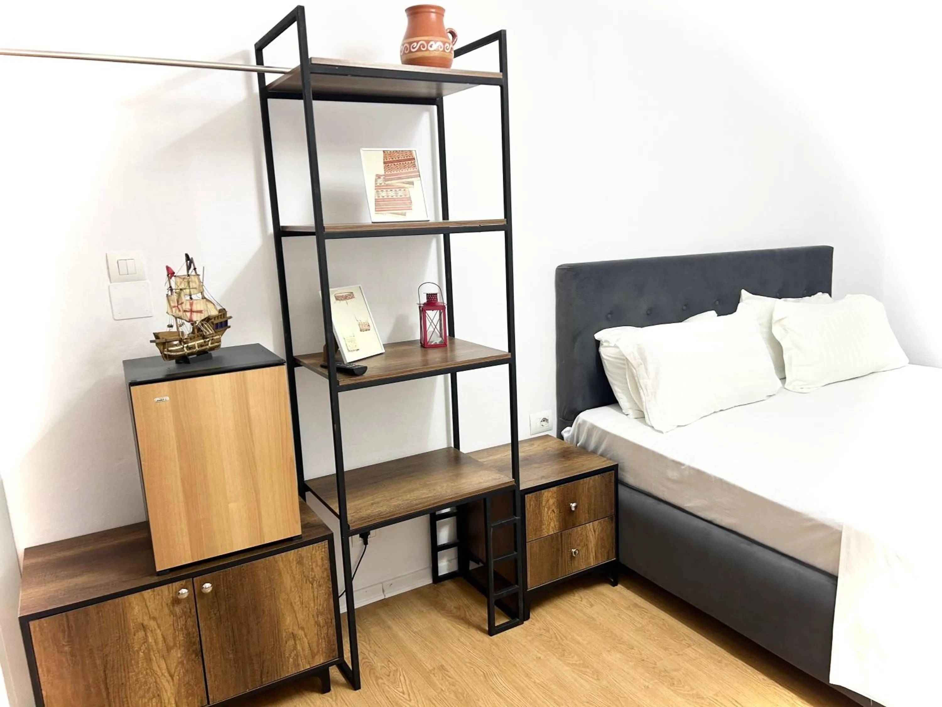wardrobe, Bed in Budget Retreat Tirana & Studios