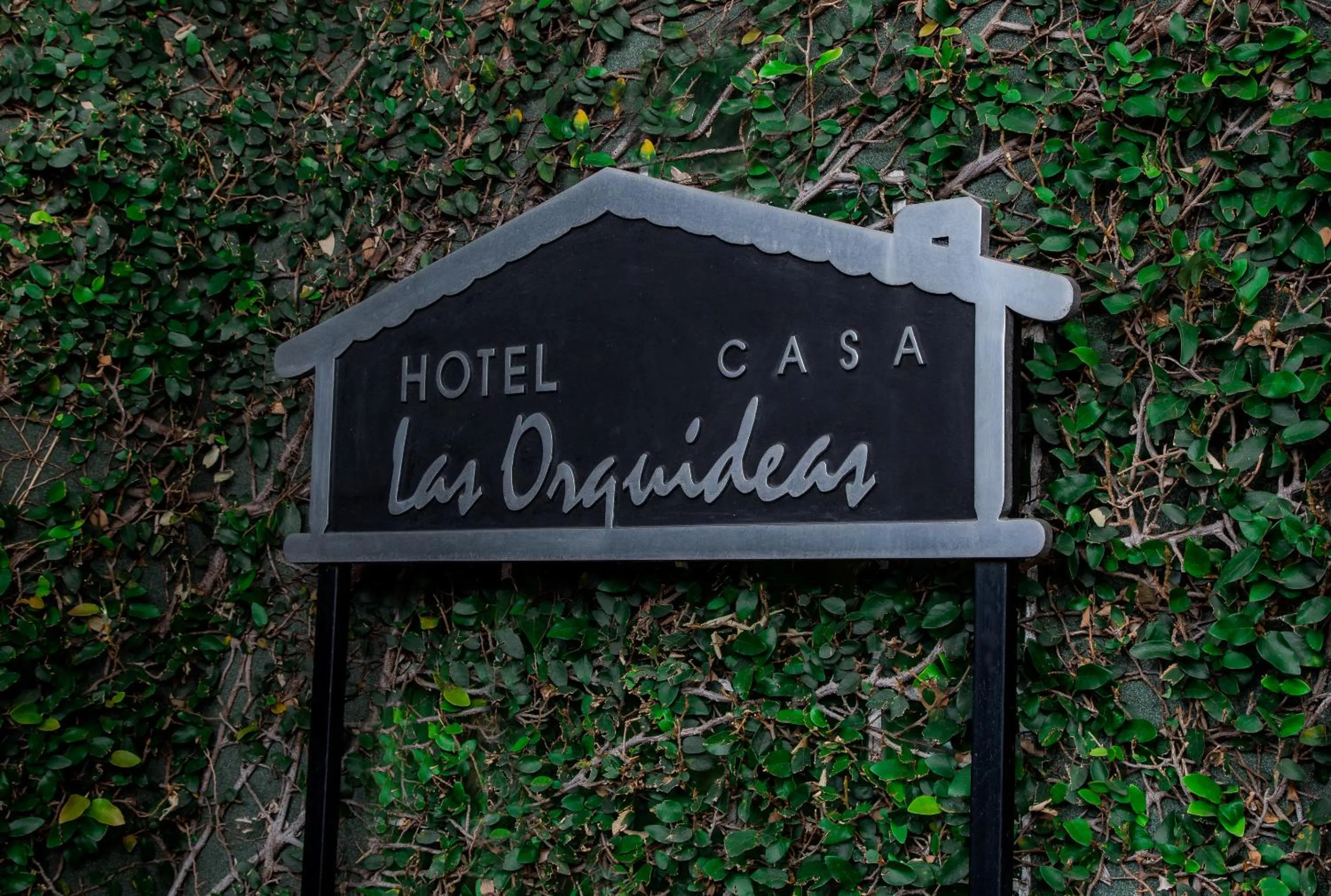 Property logo or sign in Boutique Hotel Casa Orquídeas