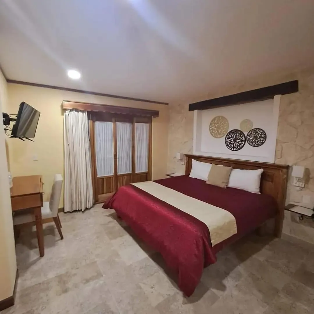 Bed in Cancun International Suites